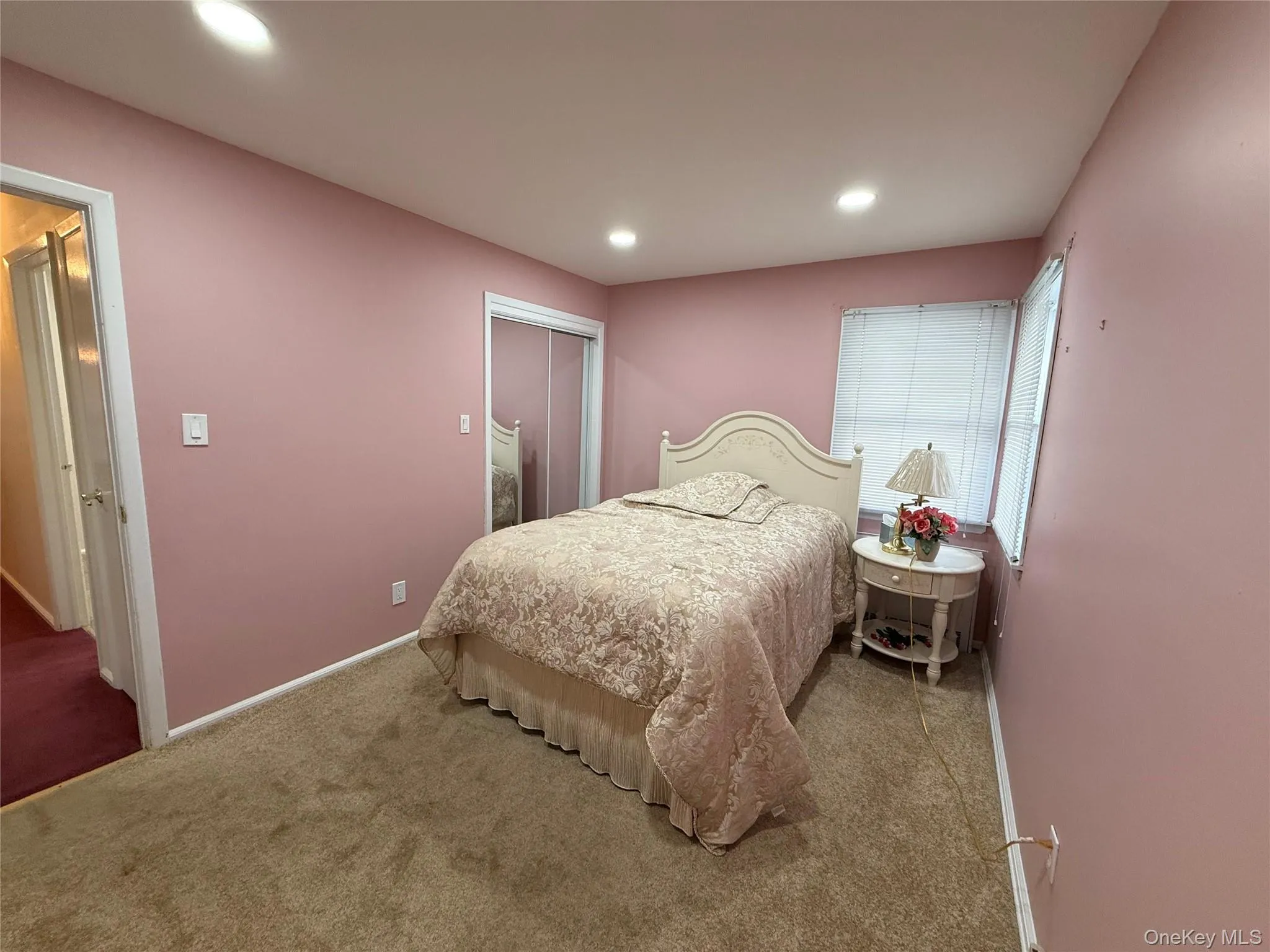 Bedroom with carpet, a closet, and recessed lighting Bedroom with carpet, a closet, and recessed lighting