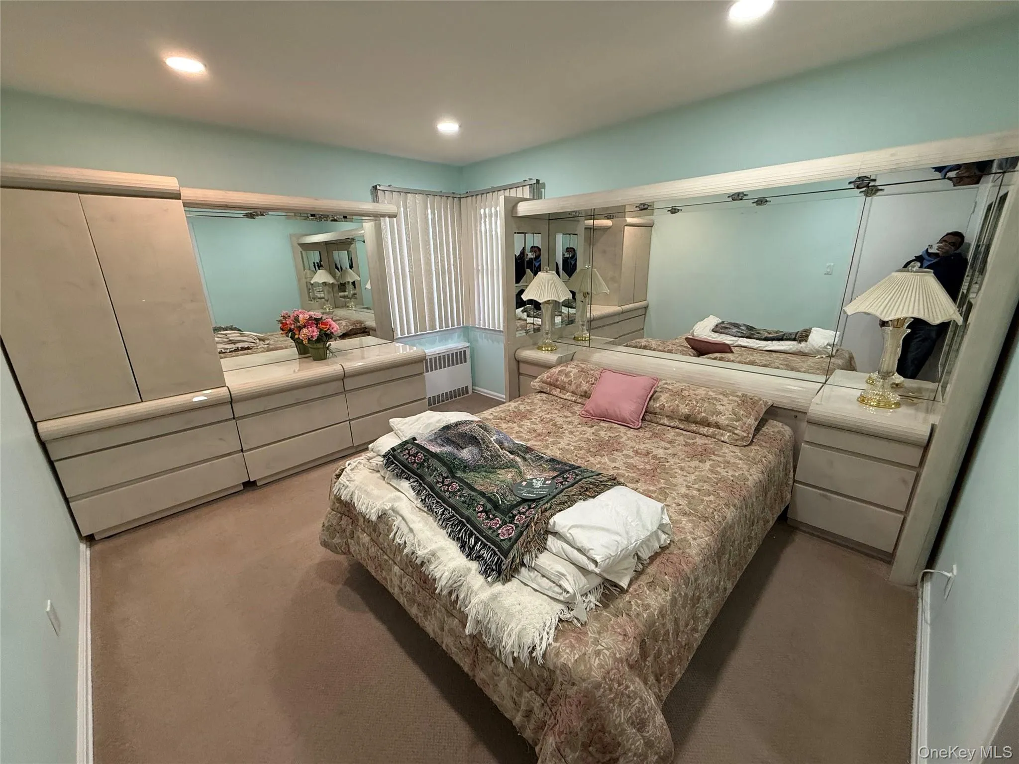 Bedroom with carpet, radiator heating unit, and recessed lighting Bedroom with carpet, radiator heating unit, and recessed lighting