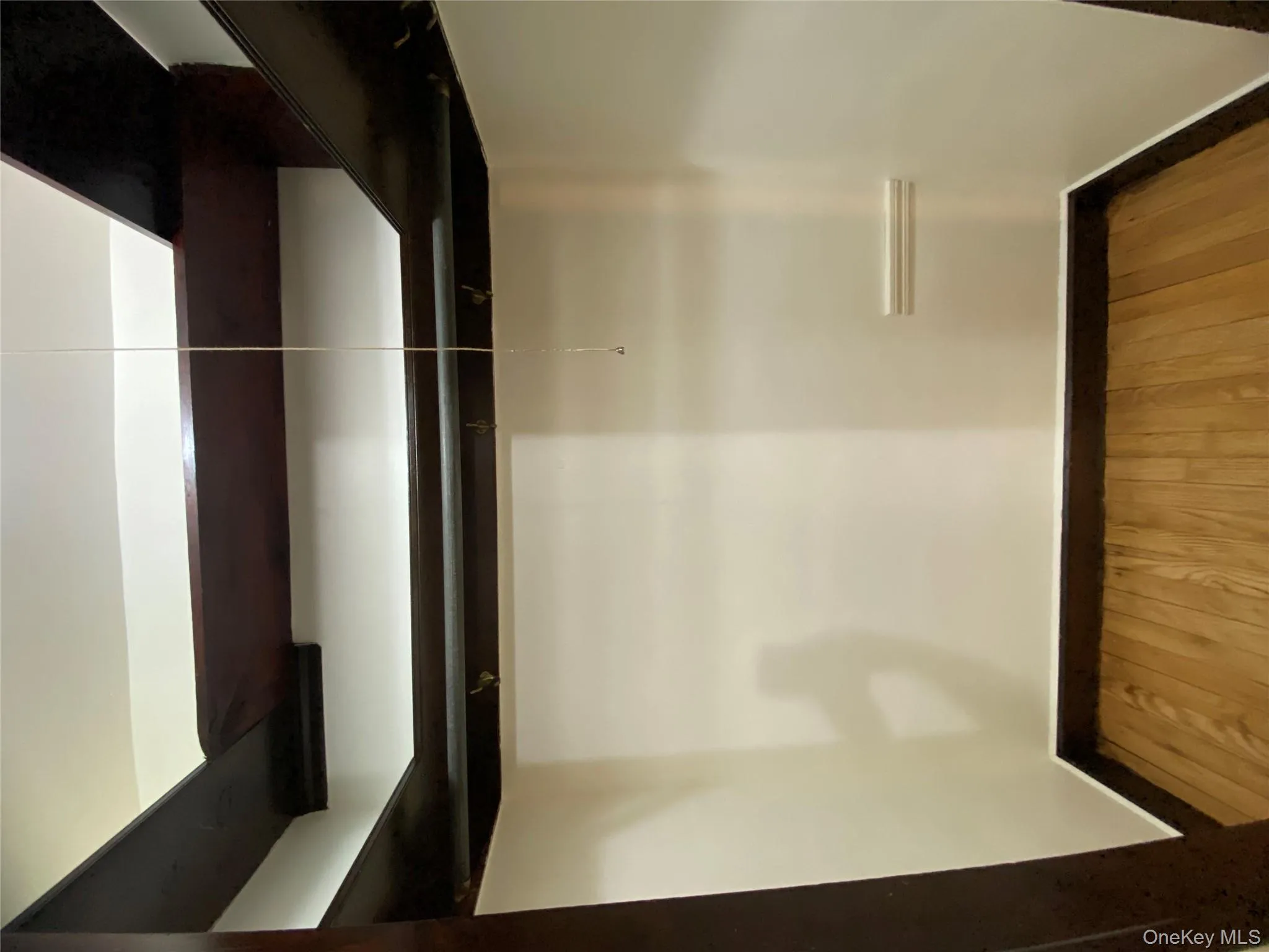 Spacious closet featuring light wood-style flooring Spacious closet featuring light wood-style flooring