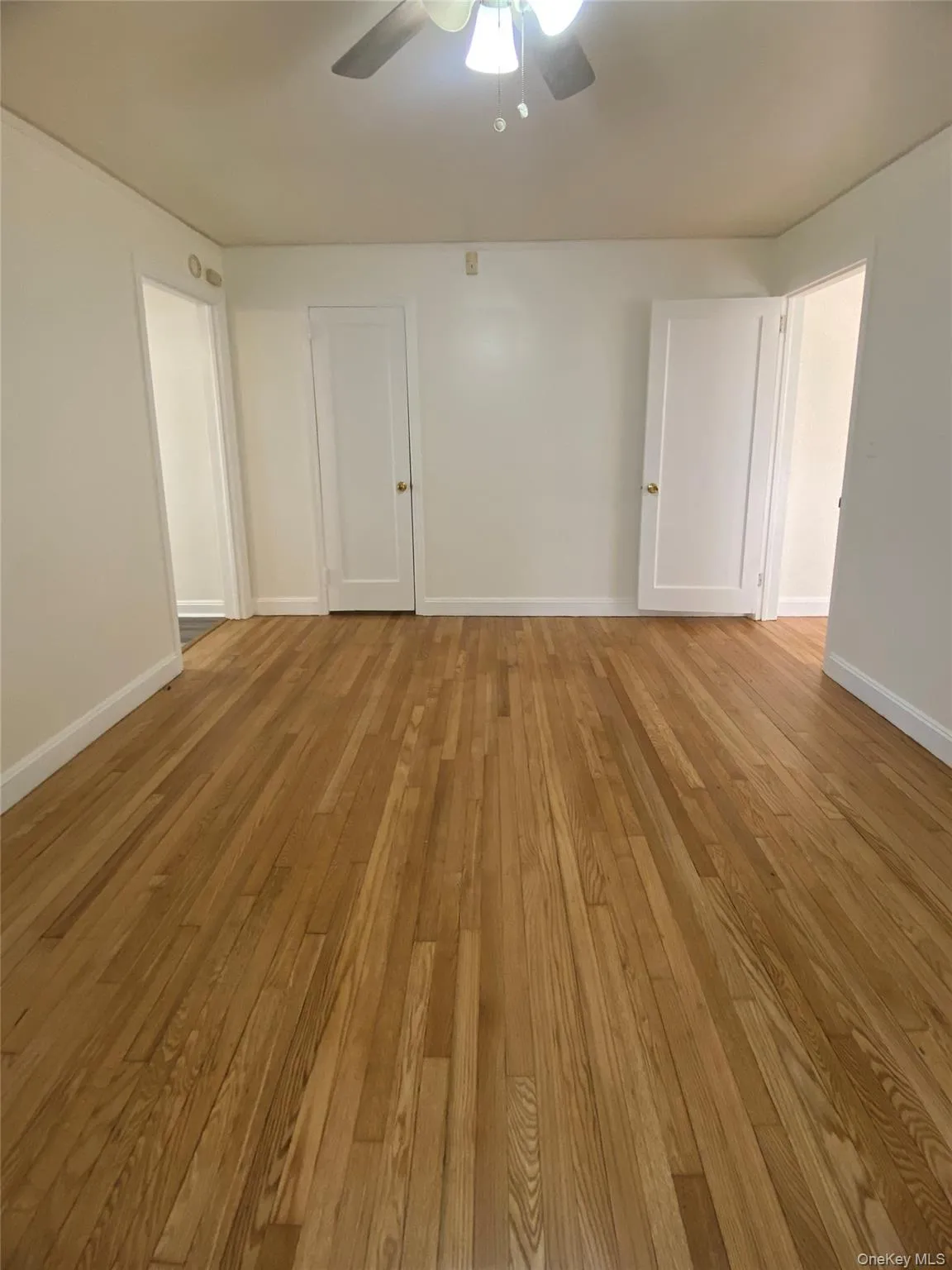 Unfurnished room with light wood-style flooring Unfurnished room with light wood-style flooring