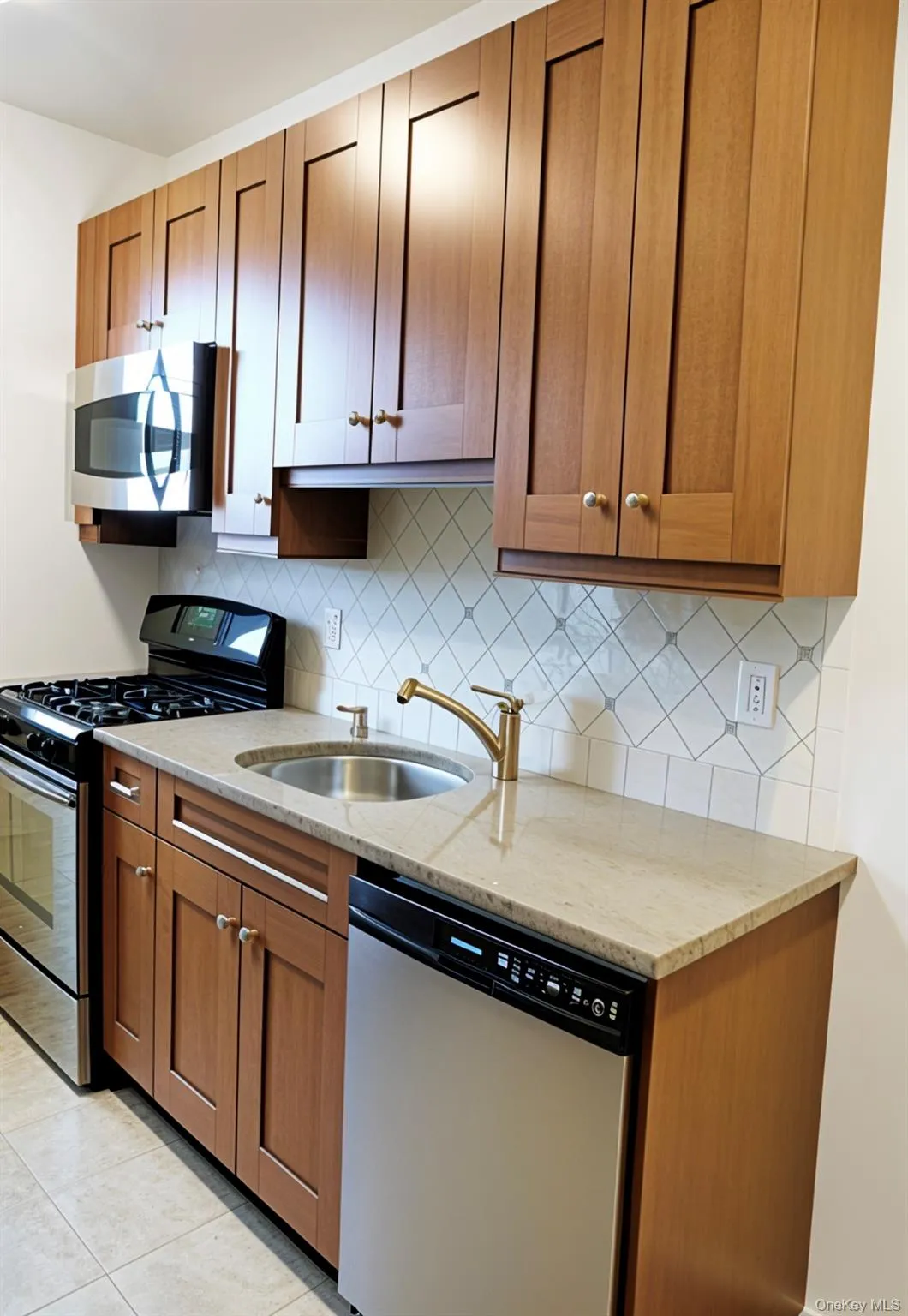 Kitchen featuring light stone counters, appliances with stainless steel finishes, brown cabinets, and tasteful backsplash Kitchen featuring light stone counters, appliances with stainless steel finishes, brown cabinets, and tasteful backsplash