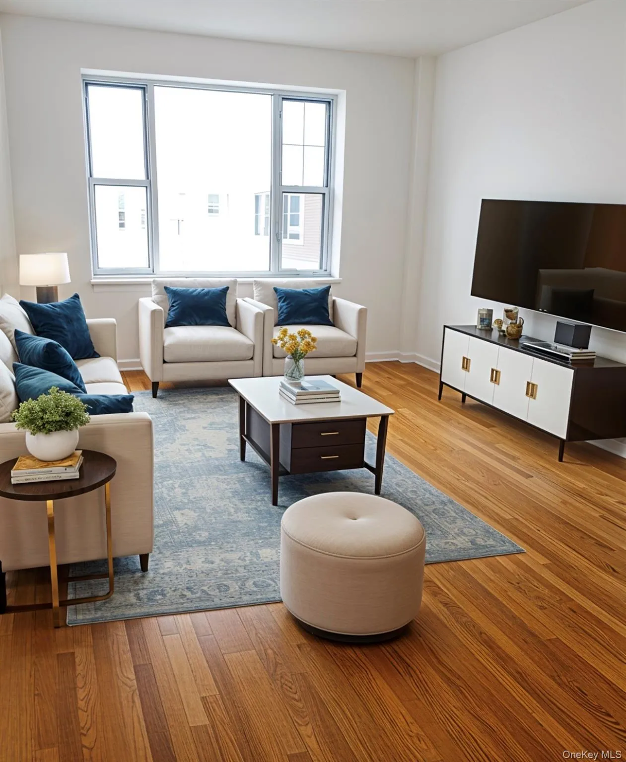 Living area featuring light wood finished floors and healthy amount of natural light Living area featuring light wood finished floors and healthy amount of natural light