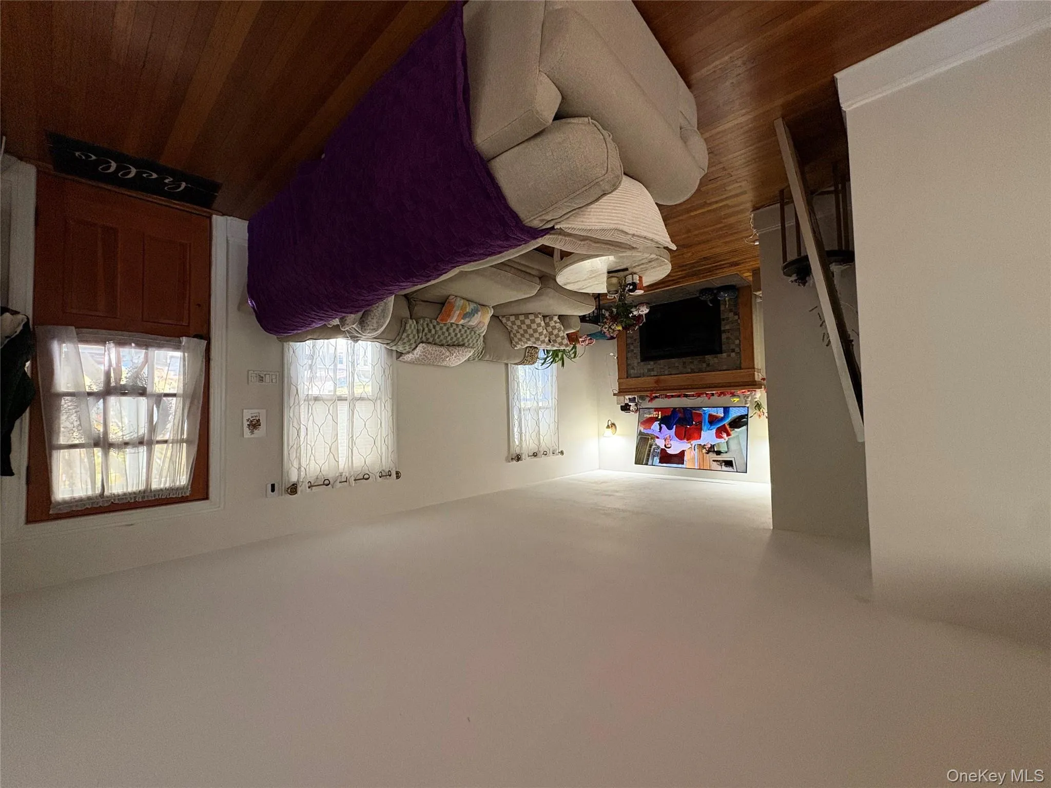 Living area with dark wood-style floors and a fireplace Living area with dark wood-style floors and a fireplace