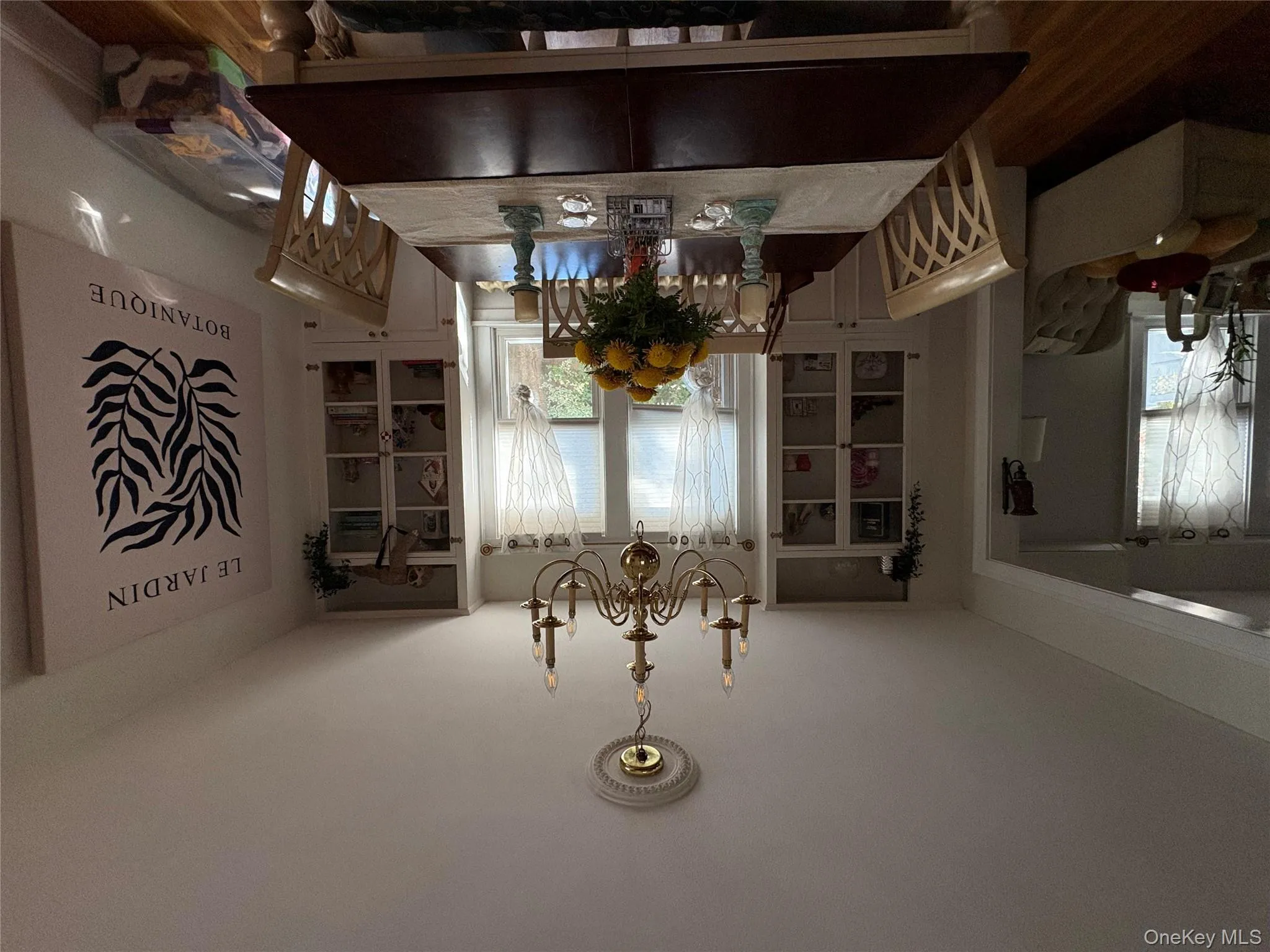 Dining room with wood finished floors and a chandelier Dining room with wood finished floors and a chandelier