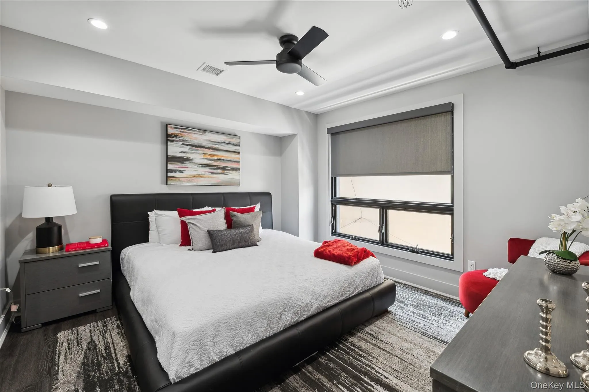 Bedroom featuring wood finished floors, ceiling fan, and recessed lighting Bedroom featuring wood finished floors, ceiling fan, and recessed lighting