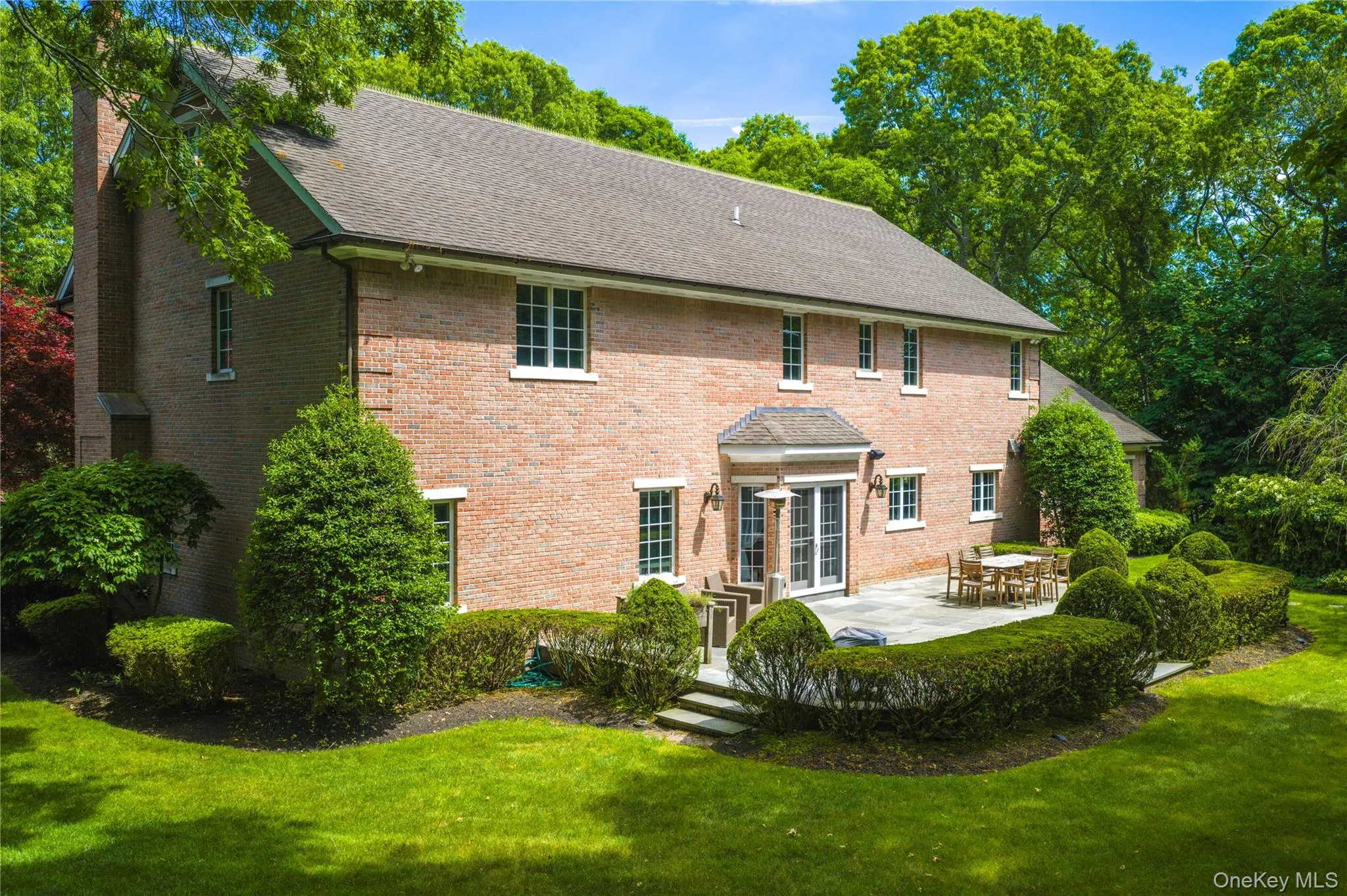 Brick and copper gutters with bluestone patio Brick and copper gutters with bluestone patio
