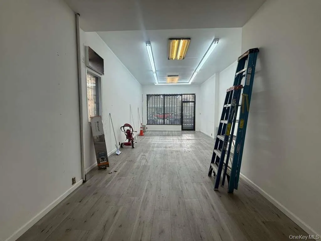 Hall with wood finished floors and baseboards Hall with wood finished floors and baseboards