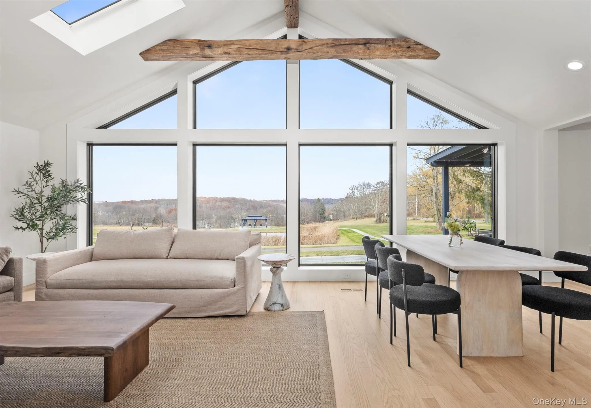 Living area with wall of windows taking in the view Living area with wall of windows taking in the view
