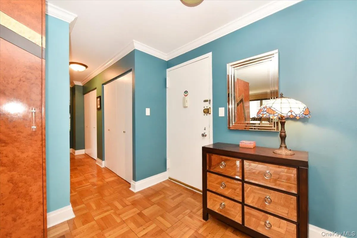 Hall with ornamental molding and baseboards Hall with ornamental molding and baseboards