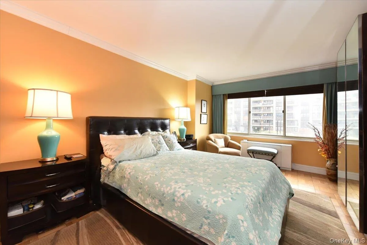 Bedroom with crown molding and baseboards Bedroom with crown molding and baseboards