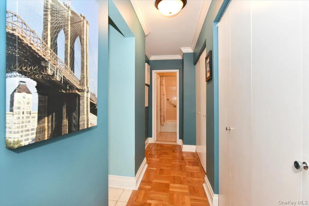 Hallway with ornamental molding and baseboards Hallway with ornamental molding and baseboards