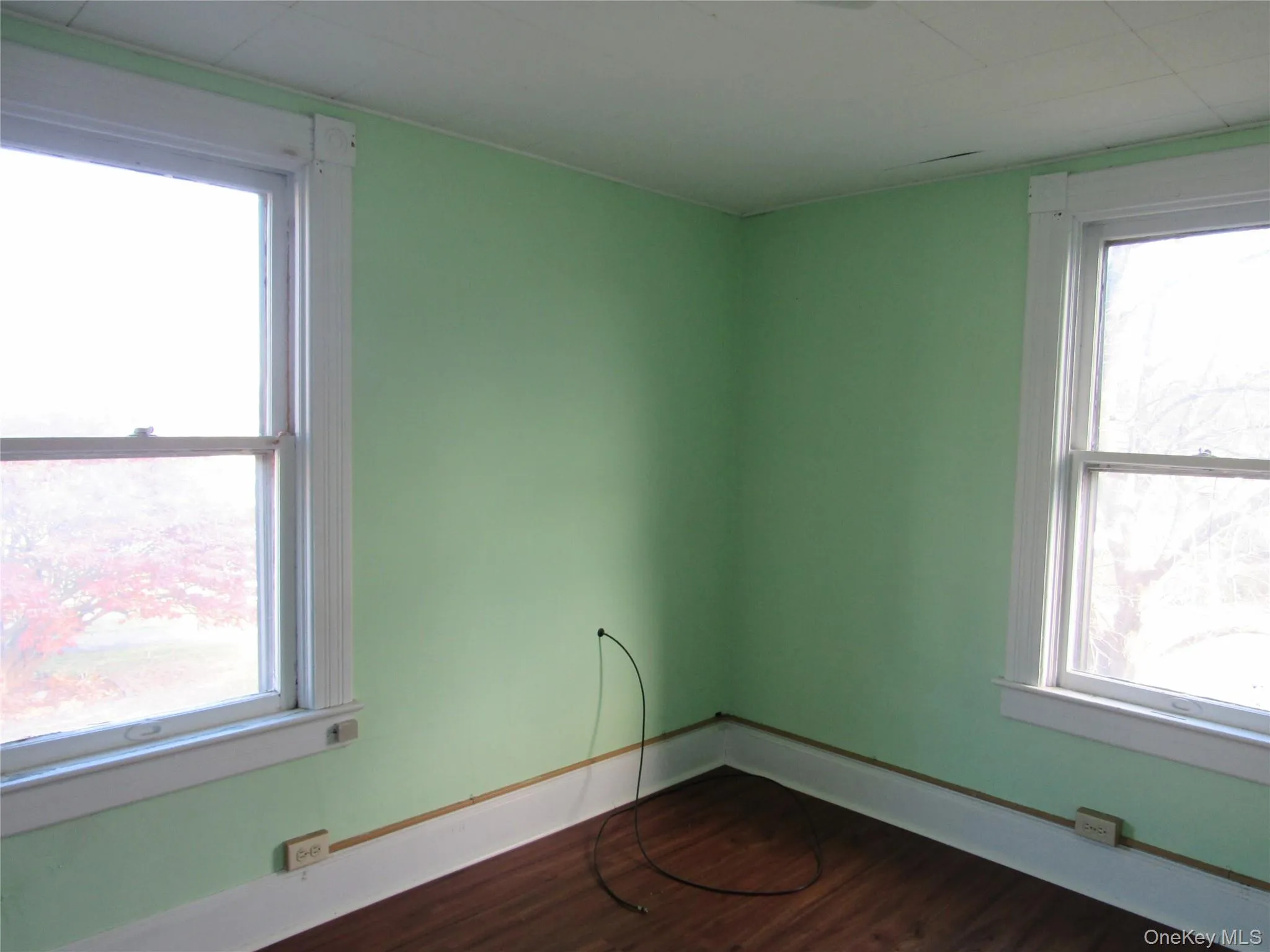 Bedroom #2 featuring dark wood finished floors and baseboards Bedroom #2 featuring dark wood finished floors and baseboards