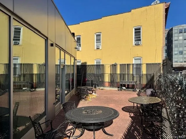 View of patio with an outdoor fire pit View of patio with an outdoor fire pit