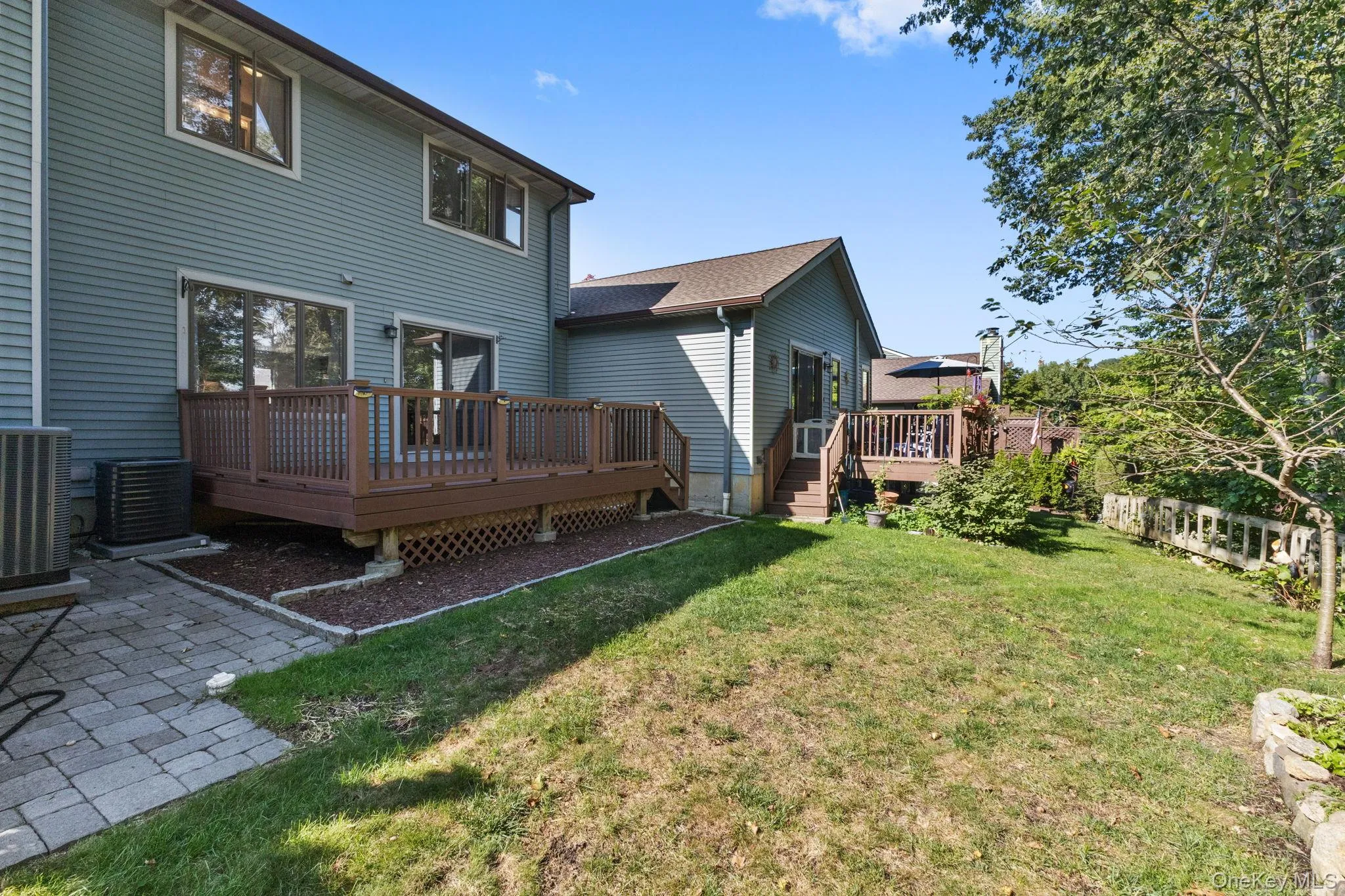 Spacious backyard with large deck, yard and scenic views, perfect for outdoor living and entertaining—come see all the features this home has to offer. Spacious backyard with large deck, yard and scenic views, perfect for outdoor living and entertaining—come see all the features this home has to offer.