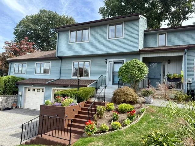 Welcome home to a charming front exterior with pretty gardens and inviting curb appeal—don’t miss this beautifully updated townhouse. Welcome home to a charming front exterior with pretty gardens and inviting curb appeal—don’t miss this beautifully updated townhouse.