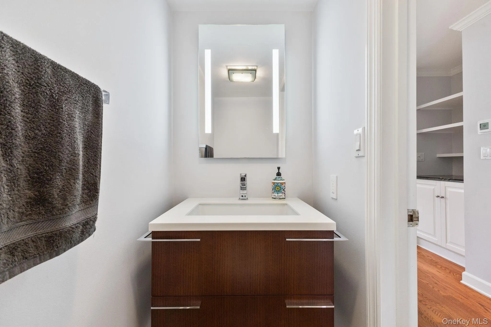 Convenient main-level powder room with modern updates. Convenient main-level powder room with modern updates.