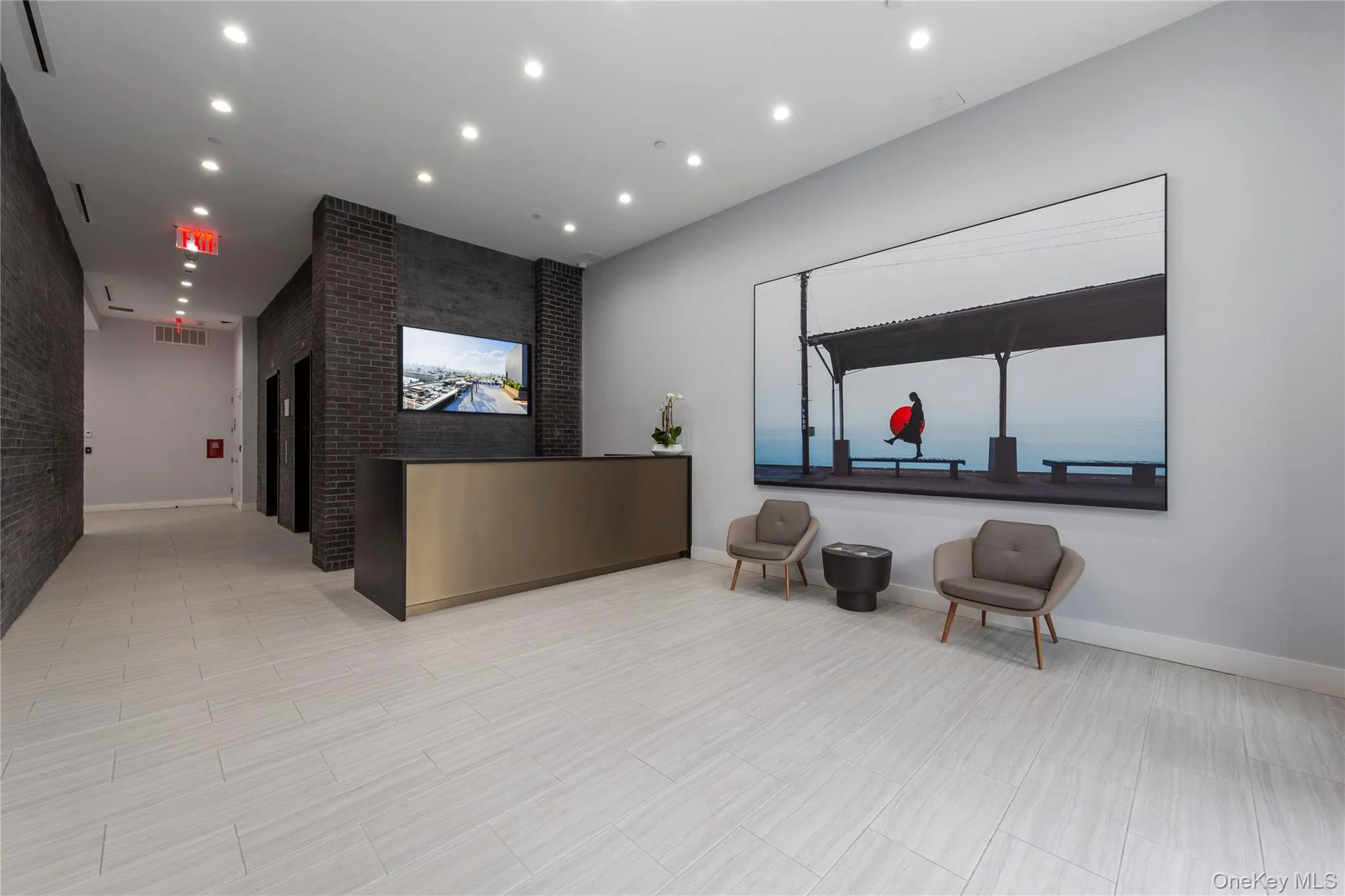 Reception featuring recessed lighting and brick wall Reception featuring recessed lighting and brick wall