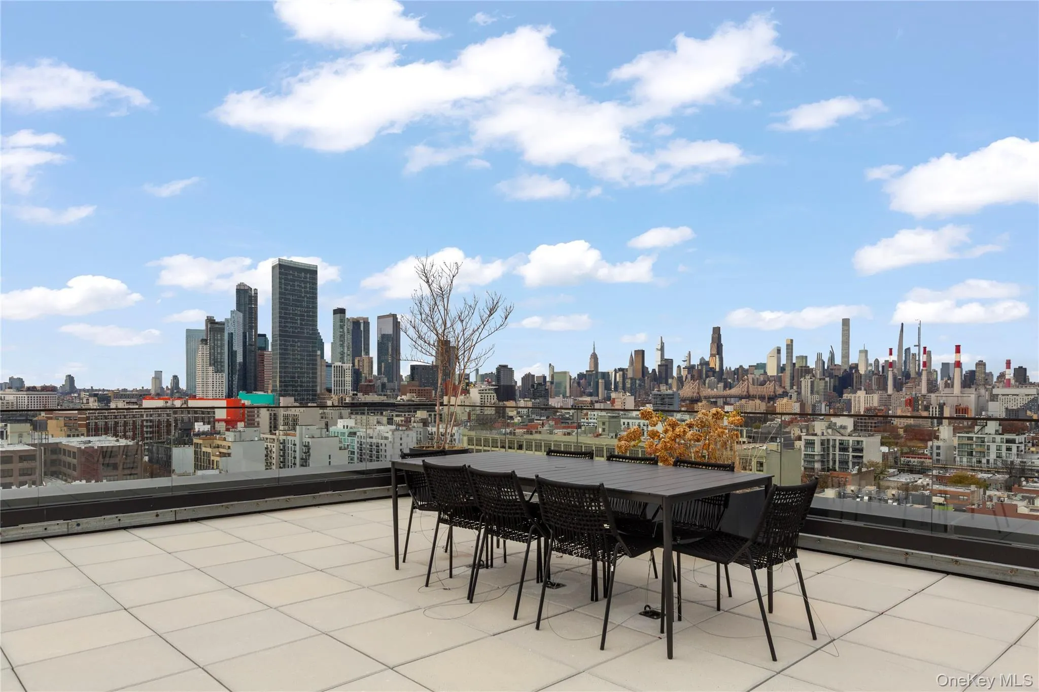 View of patio with a view of skyline and outdoor dining area View of patio with a view of skyline and outdoor dining area