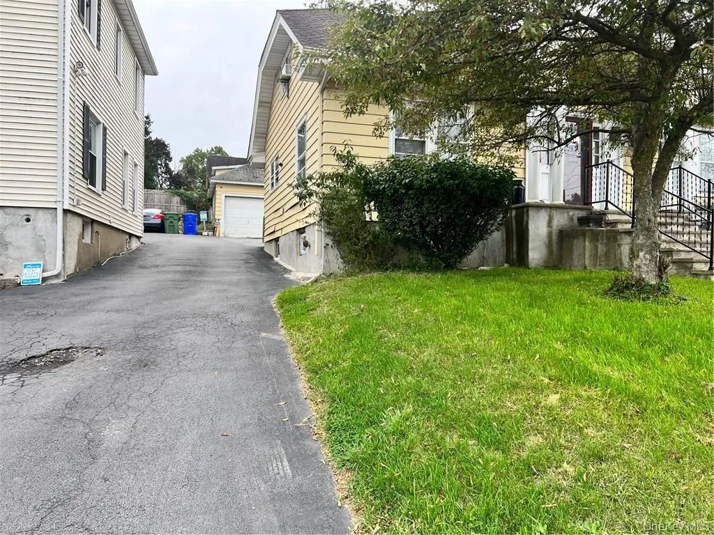 Driveway goes to the back of the house Driveway goes to the back of the house