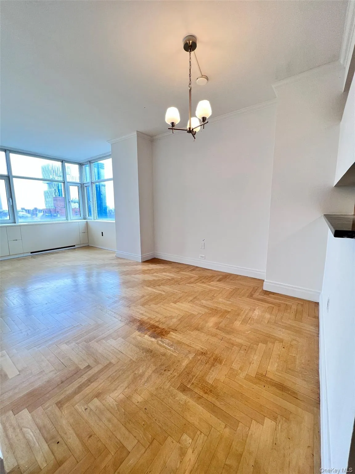 Unfurnished dining area with a chandelier and crown molding Unfurnished dining area with a chandelier and crown molding