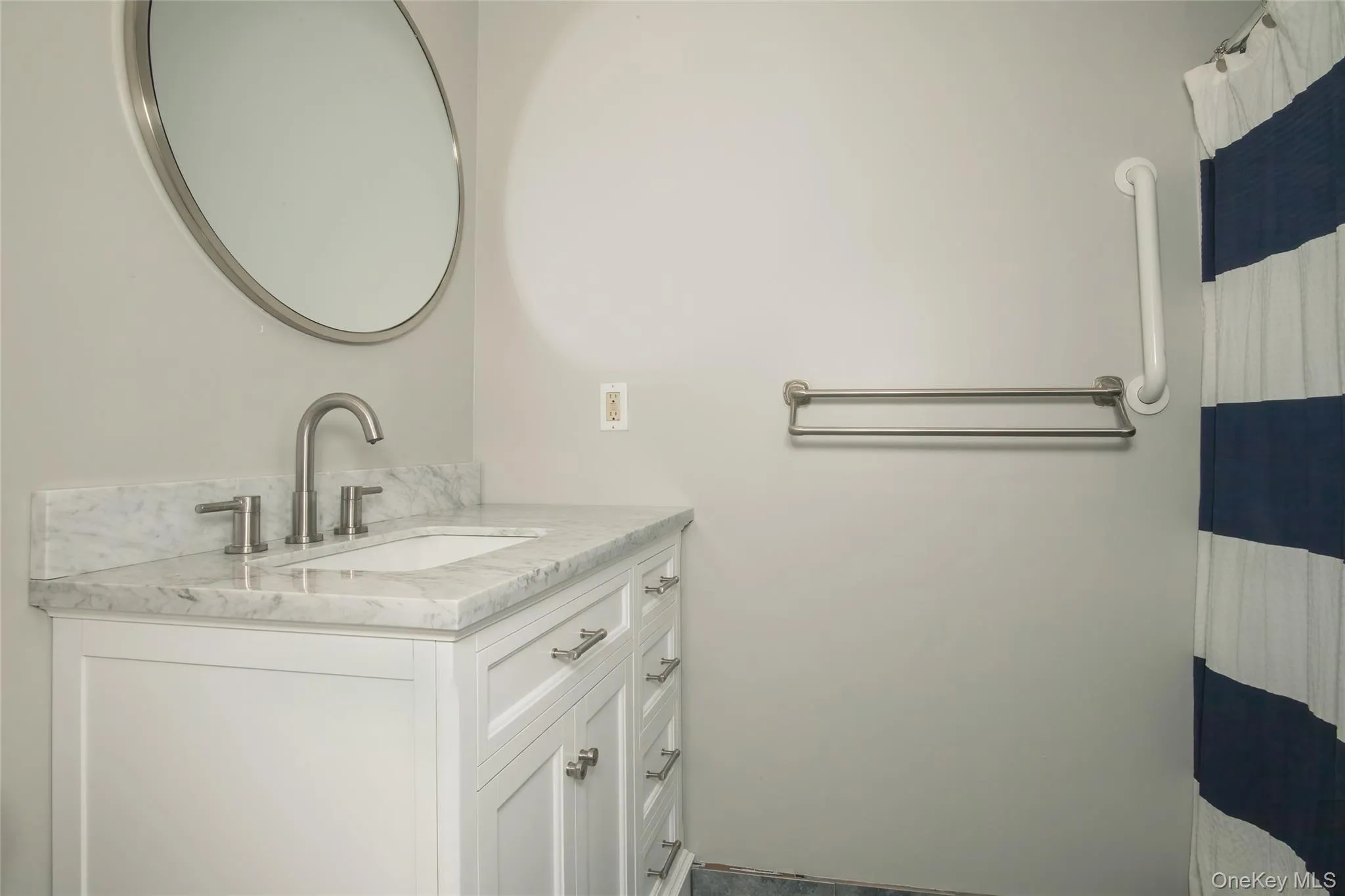 Full bath featuring vanity and a shower with curtain Full bath featuring vanity and a shower with curtain