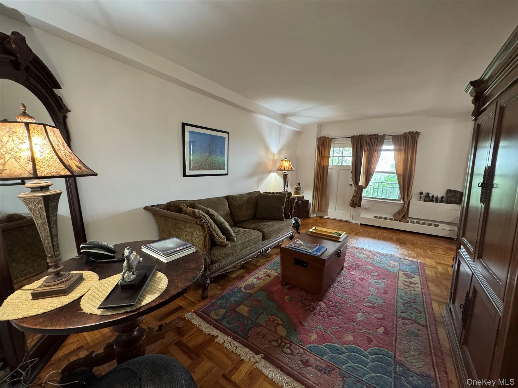 Living area featuring baseboard heating Living area featuring baseboard heating