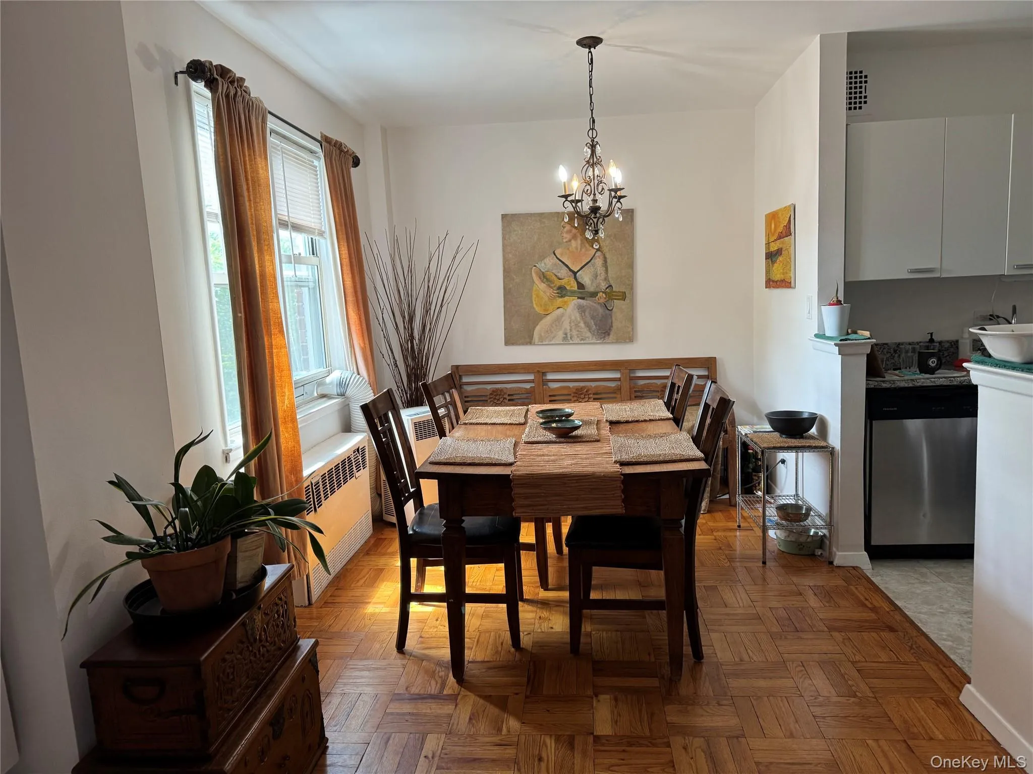 Dining room with radiator and a chandelier Dining room with radiator and a chandelier