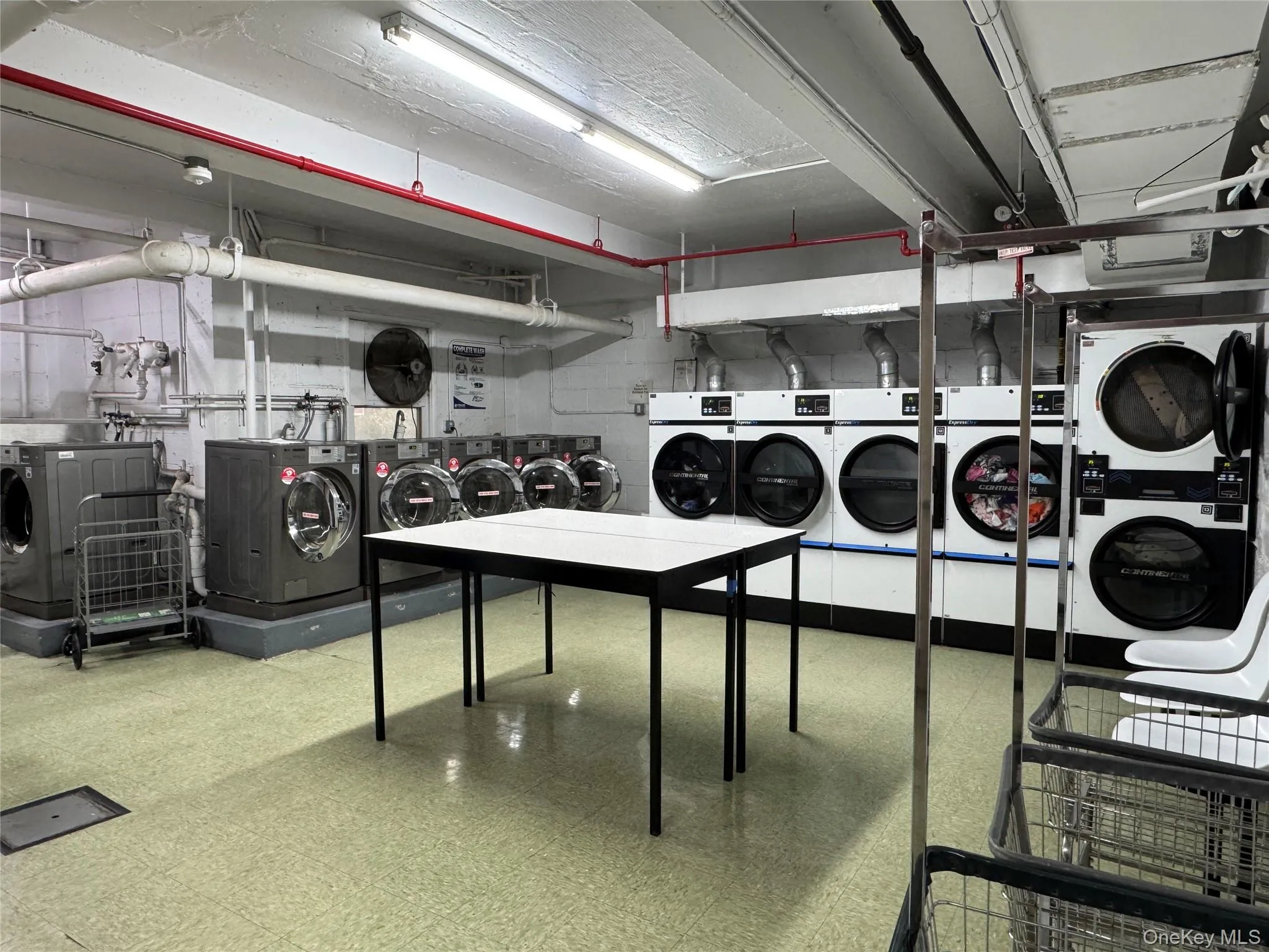 Community laundry featuring separate washer and dryer Community laundry featuring separate washer and dryer