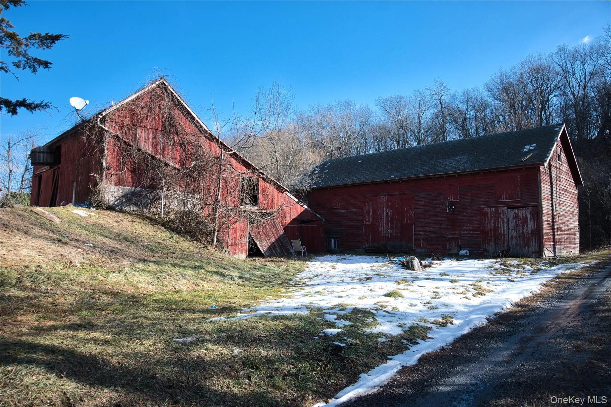 View of property exterior featuring a barn and an outdoor structure View of property exterior featuring a barn and an outdoor structure