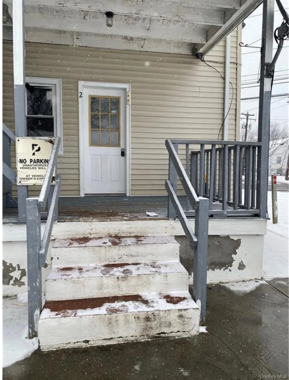 Doorway to property featuring covered porch Doorway to property featuring covered porch