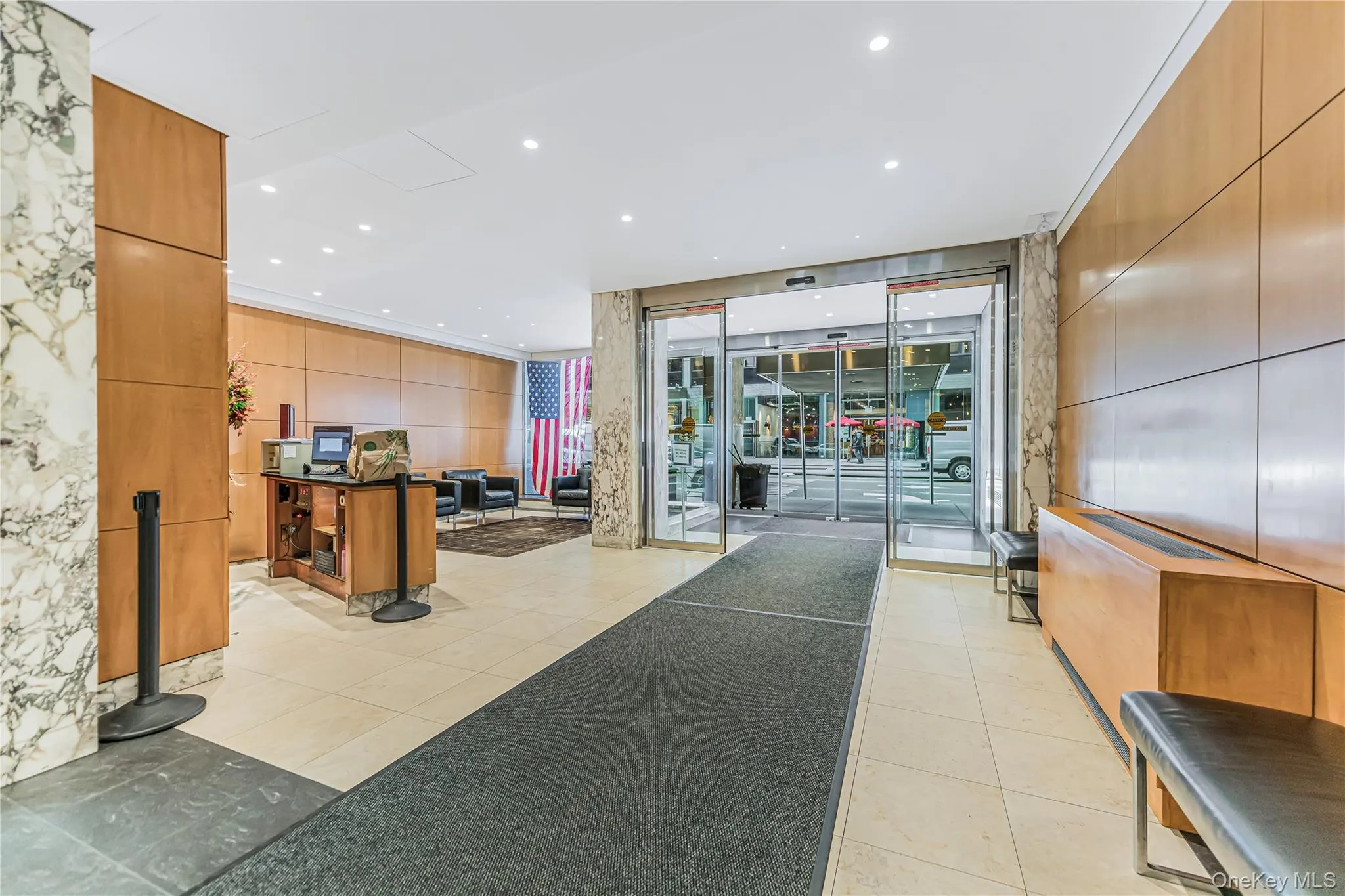 Common area featuring recessed lighting and a wall of windows Common area featuring recessed lighting and a wall of windows