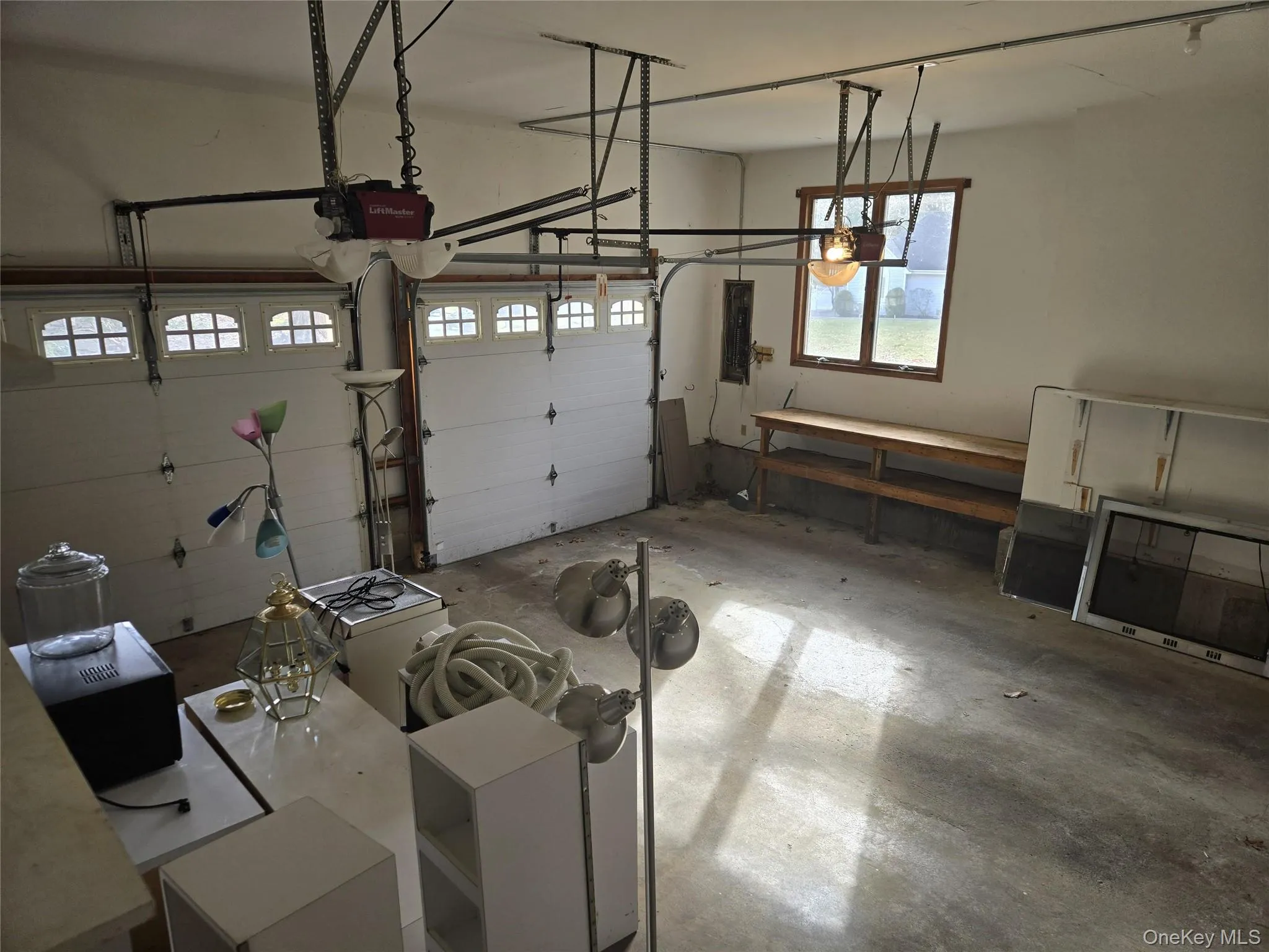 Garage with a garage door opener and electric panel Garage with a garage door opener and electric panel