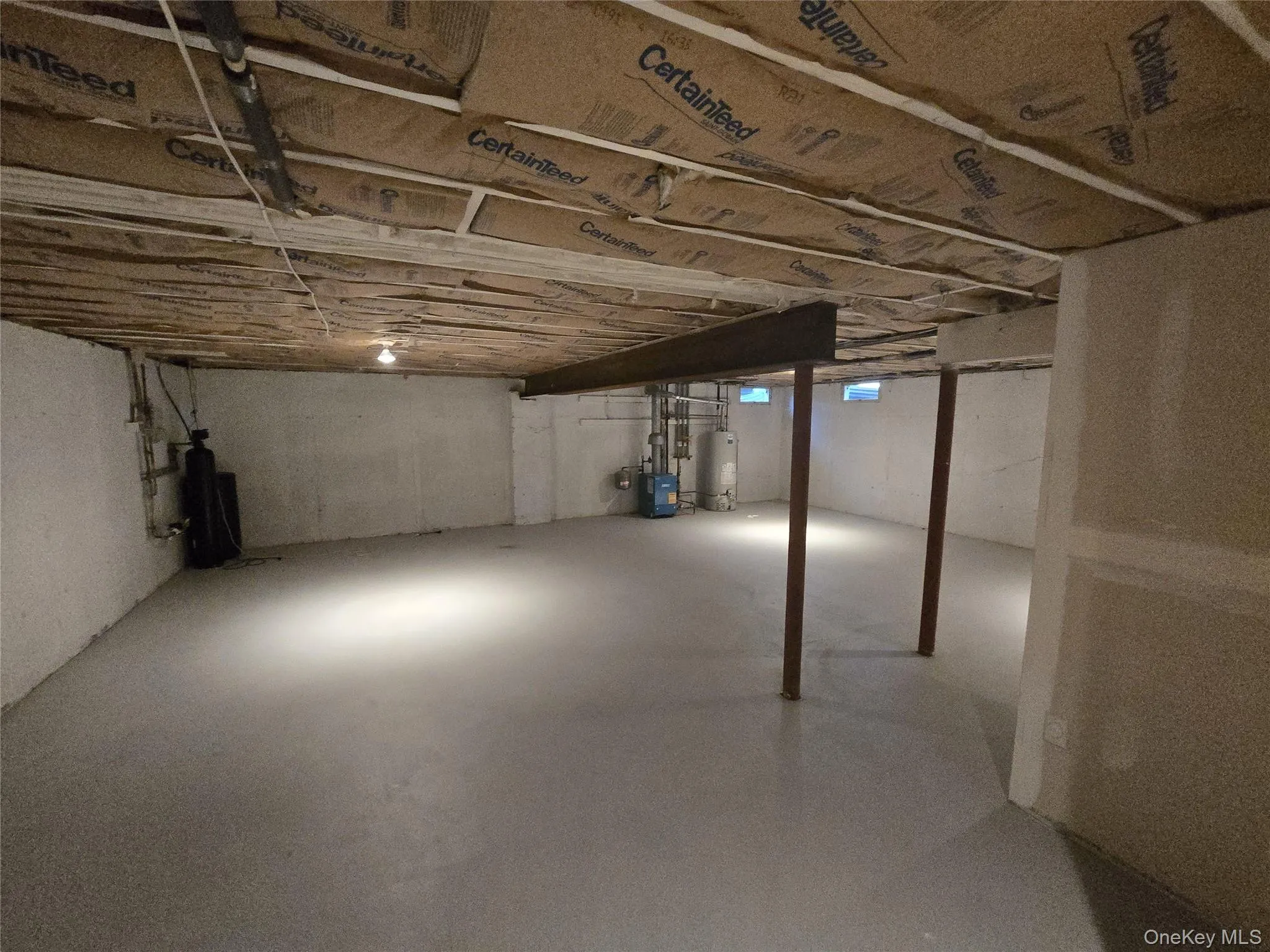 Unfinished basement featuring gas water heater Unfinished basement featuring gas water heater