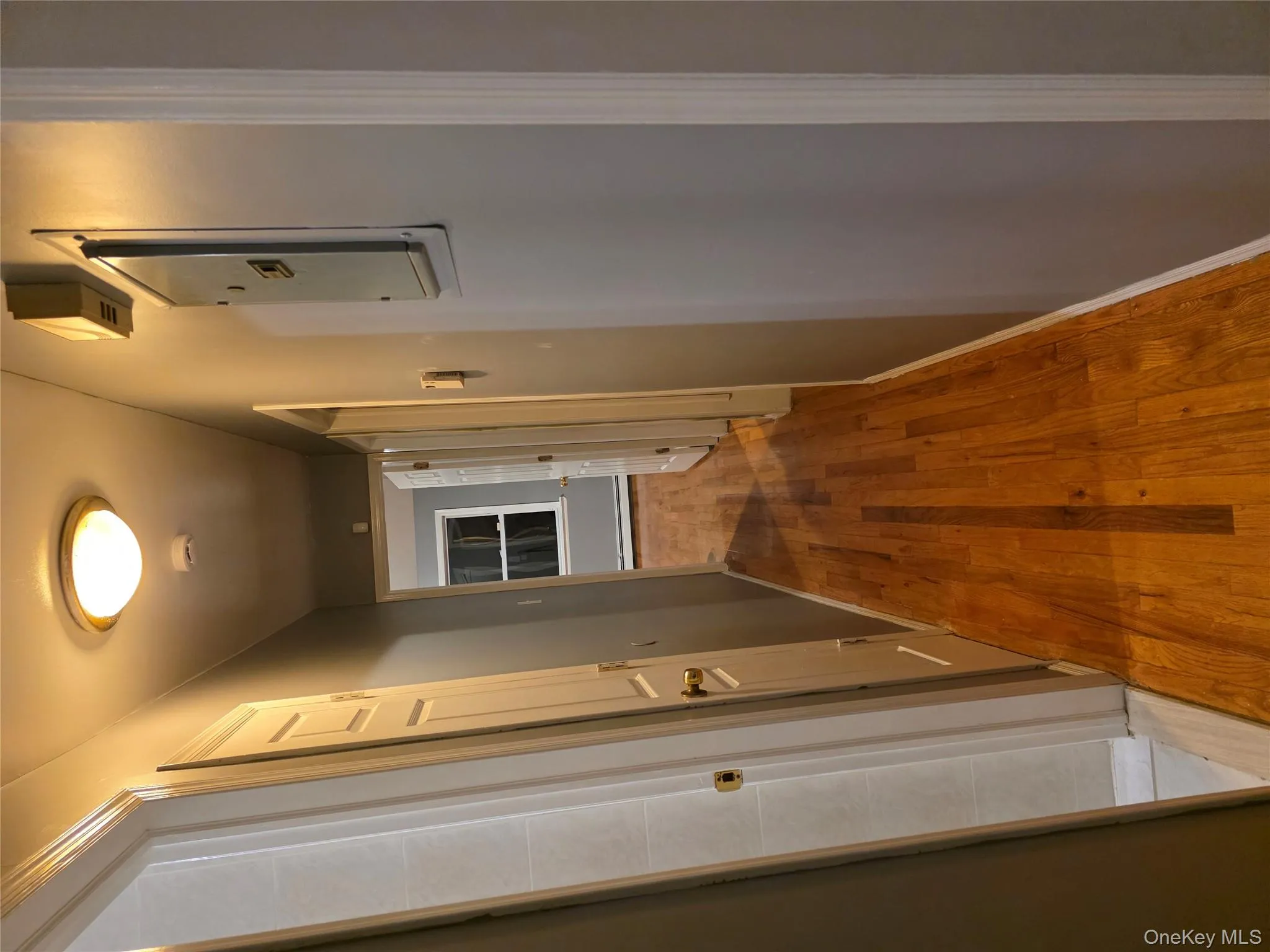 Hall with dark wood finished floors and baseboards Hall with dark wood finished floors and baseboards