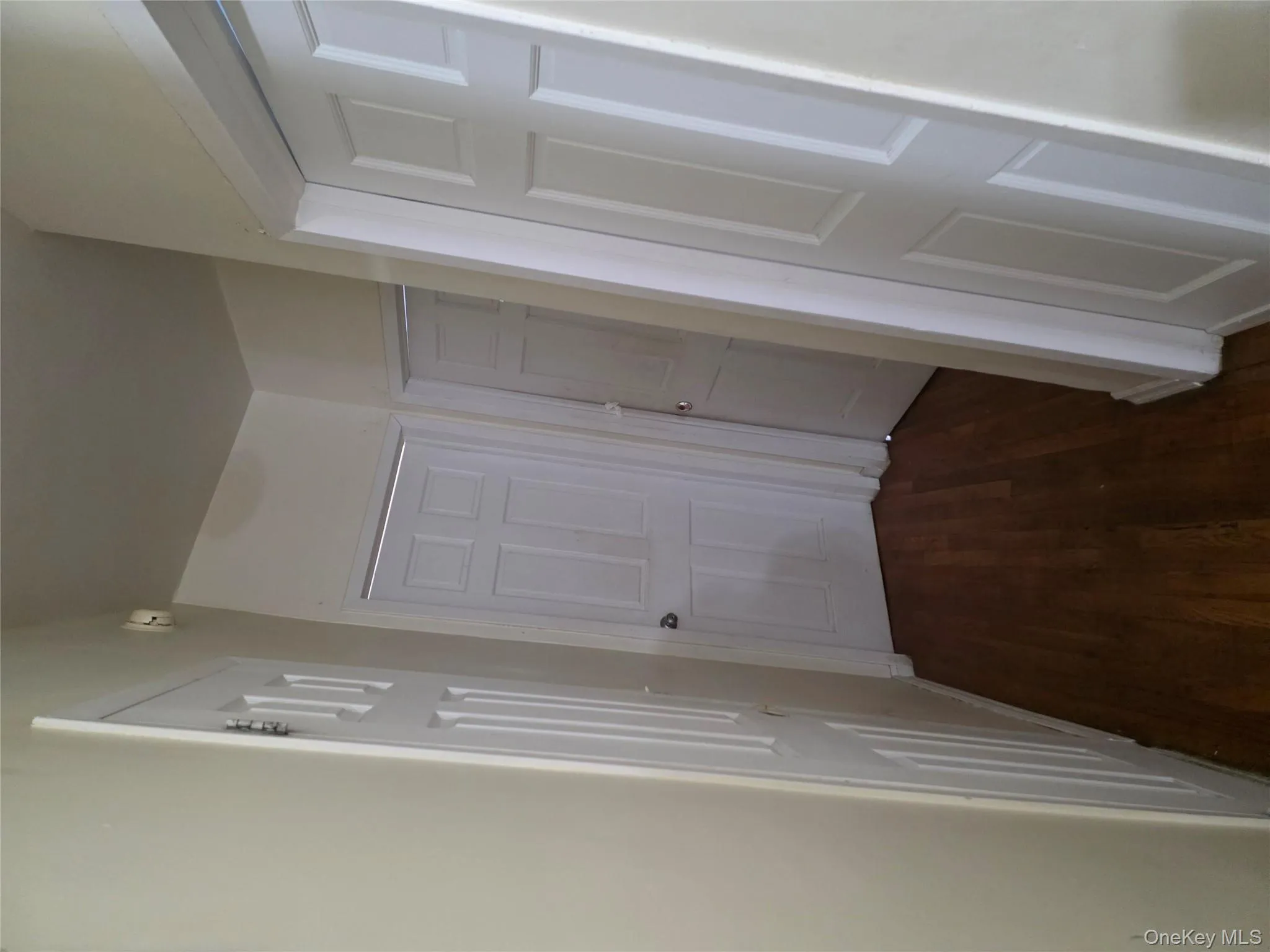 Hallway with dark wood-style flooring Hallway with dark wood-style flooring