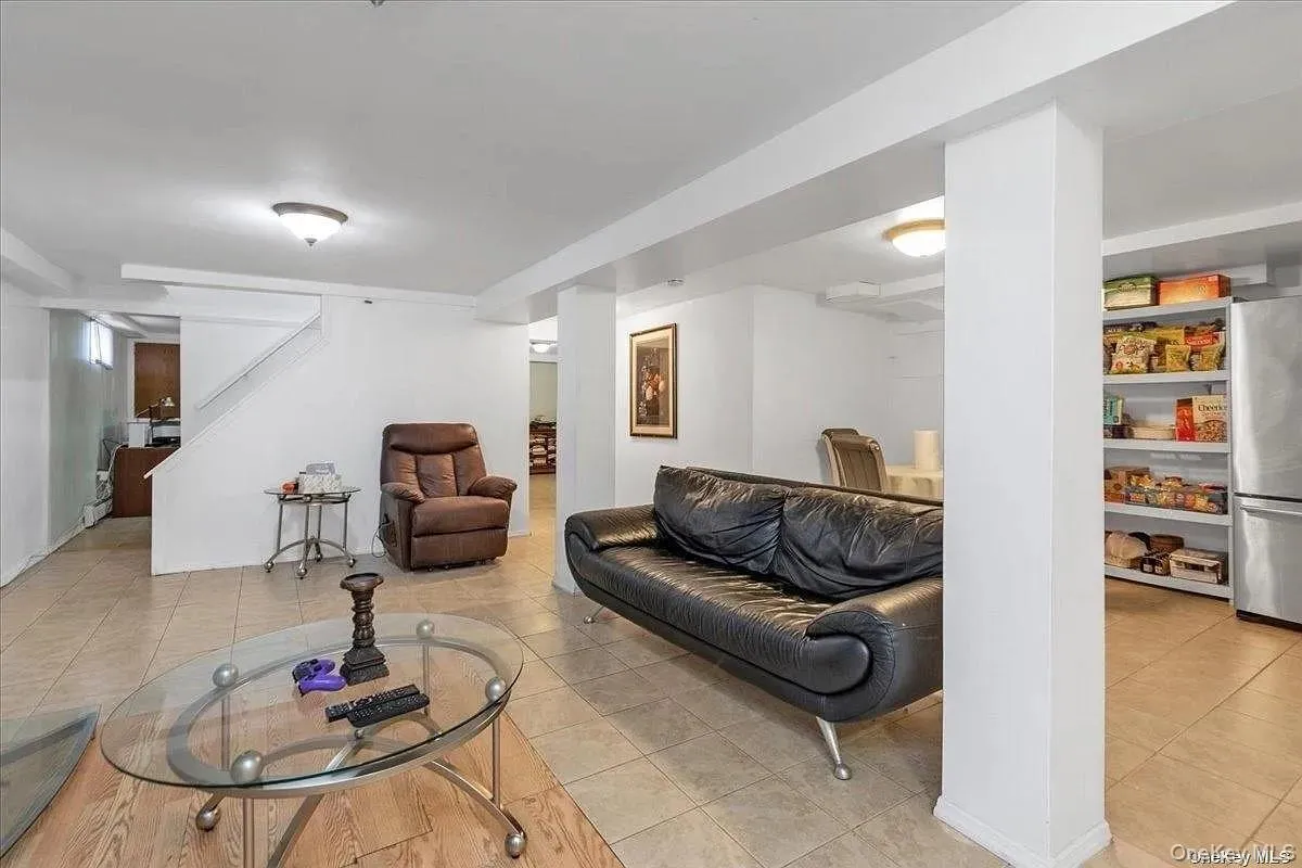 Living area with light tile patterned floors Living area with light tile patterned floors