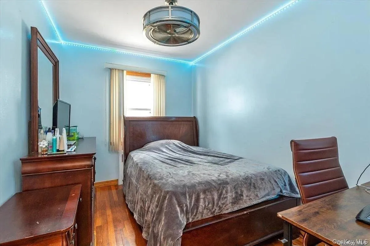 Bedroom featuring wood finished floors Bedroom featuring wood finished floors