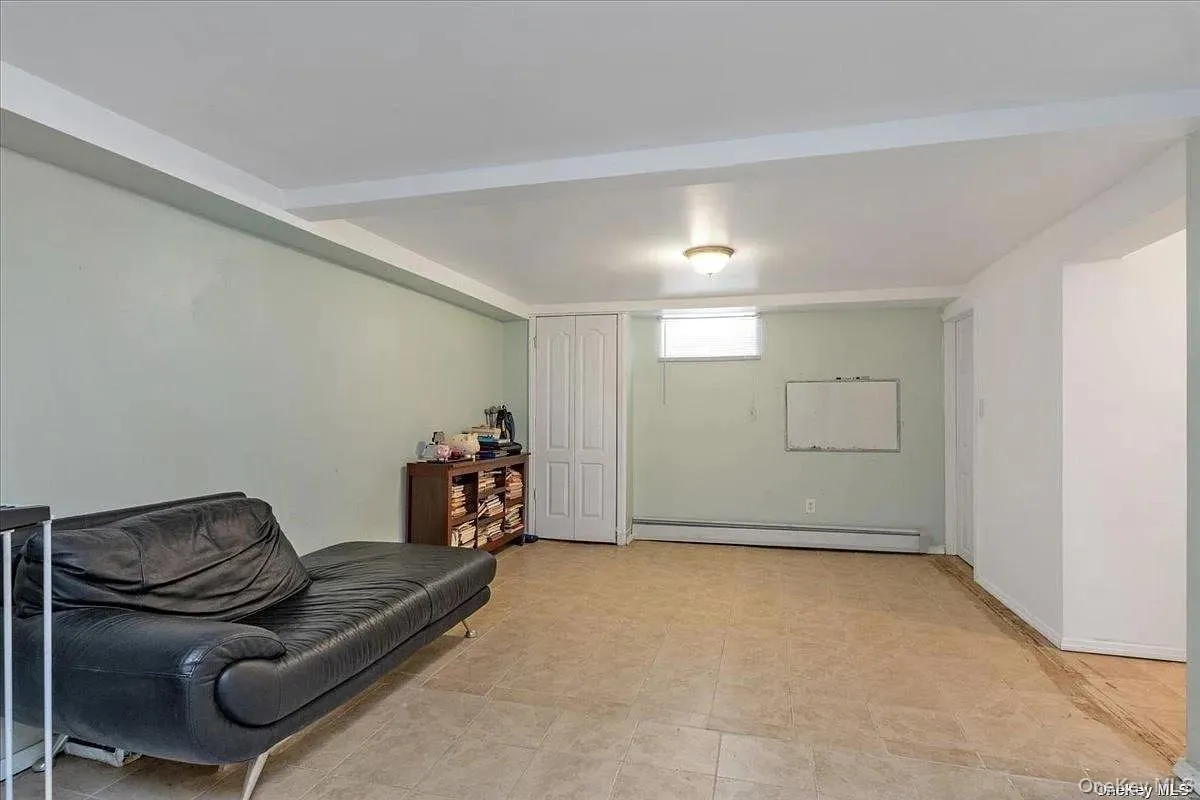 Sitting room with a baseboard radiator and baseboards Sitting room with a baseboard radiator and baseboards