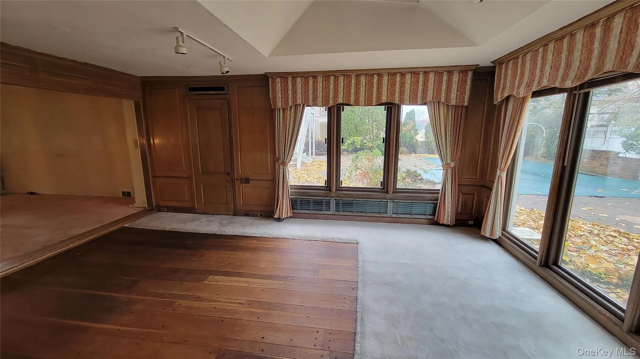 Spare room with wood walls Spare room with wood walls