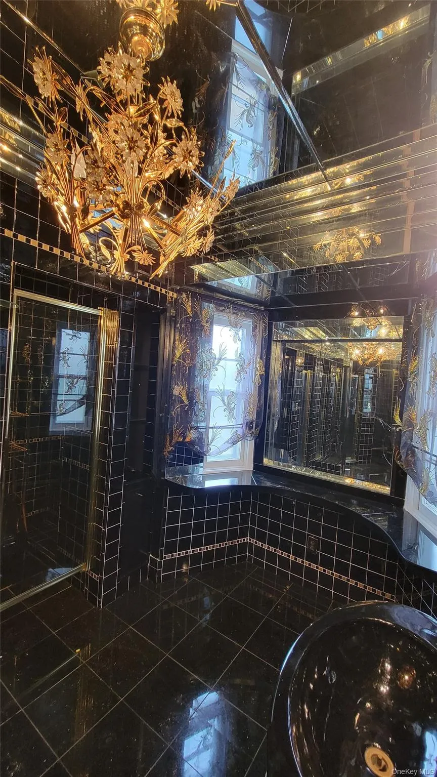 Full bath with tile walls and a stall shower Full bath with tile walls and a stall shower