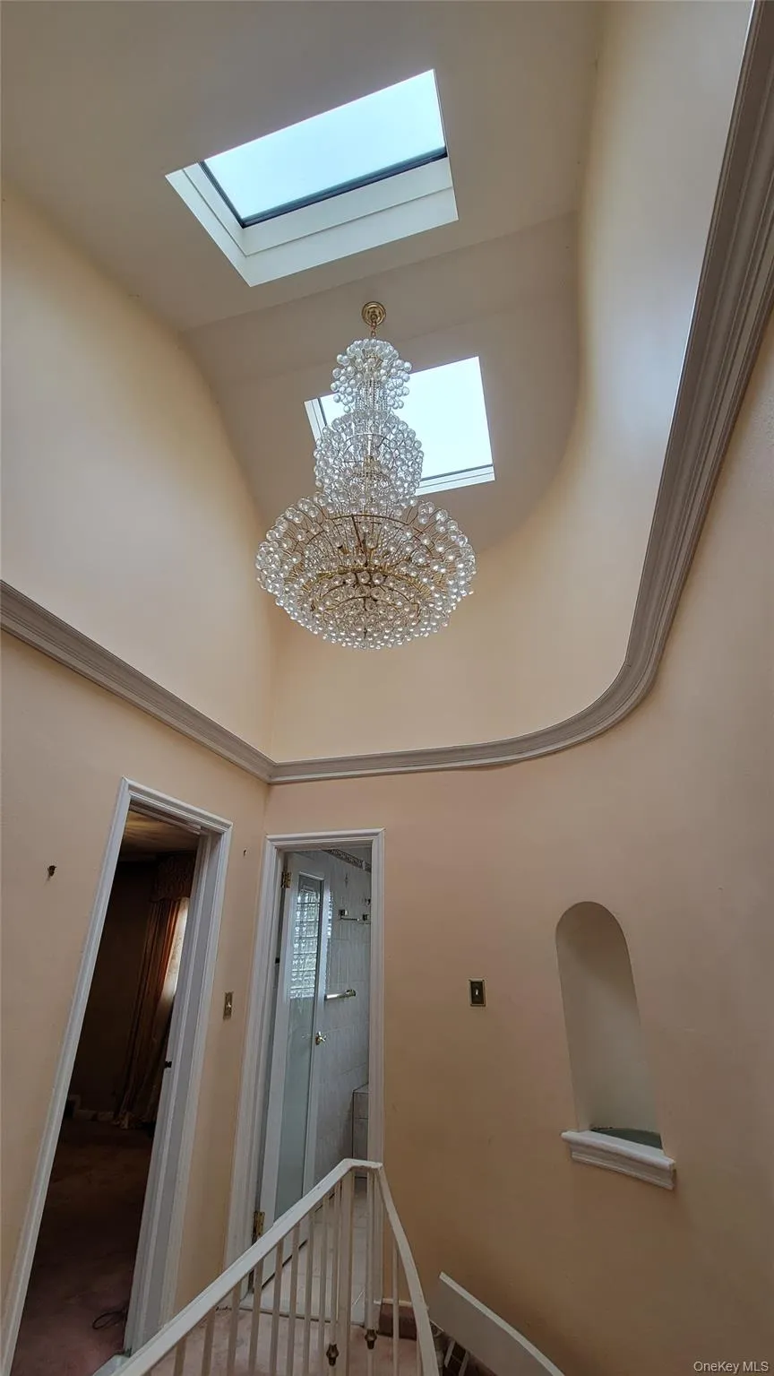 Detailed view of a chandelier and a skylight Detailed view of a chandelier and a skylight