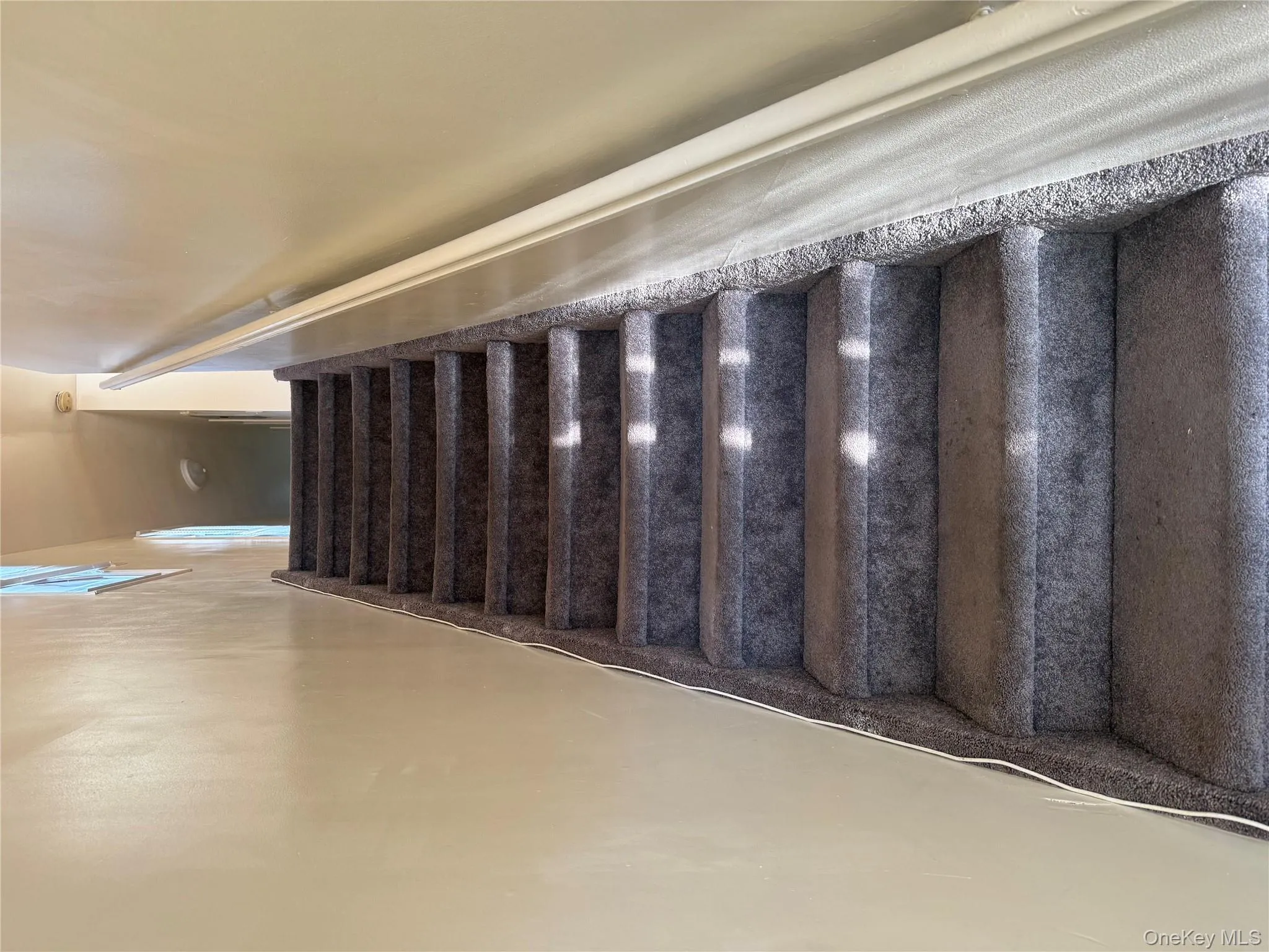 Staircase featuring baseboards Staircase featuring baseboards