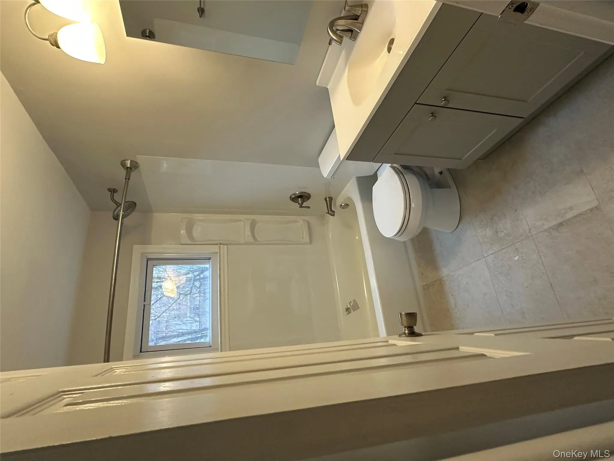 Bathroom featuring vanity and bathtub / shower combination Bathroom featuring vanity and bathtub / shower combination