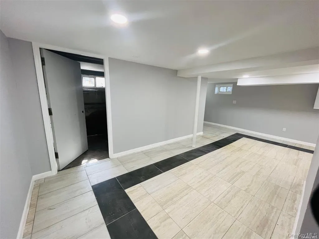 Below grade area with plenty of natural light and recessed lighting Below grade area with plenty of natural light and recessed lighting