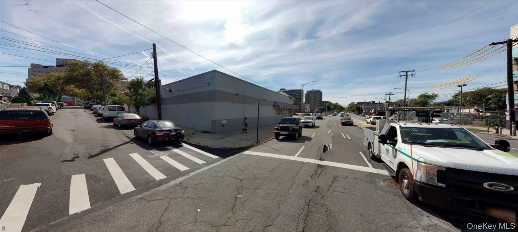 View of asphalt road with street lights View of asphalt road with street lights