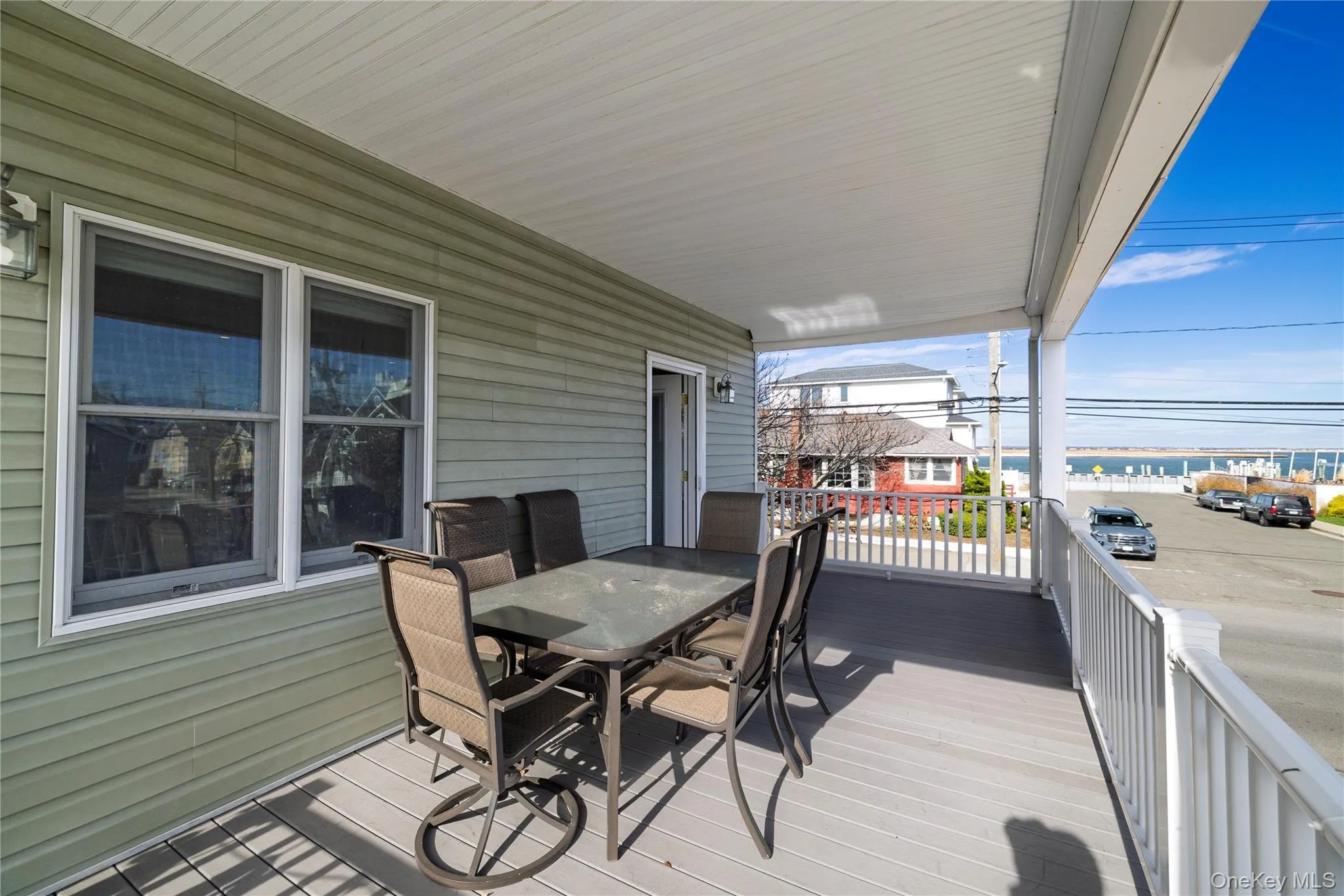 Porch featuring outdoor dining area Porch featuring outdoor dining area