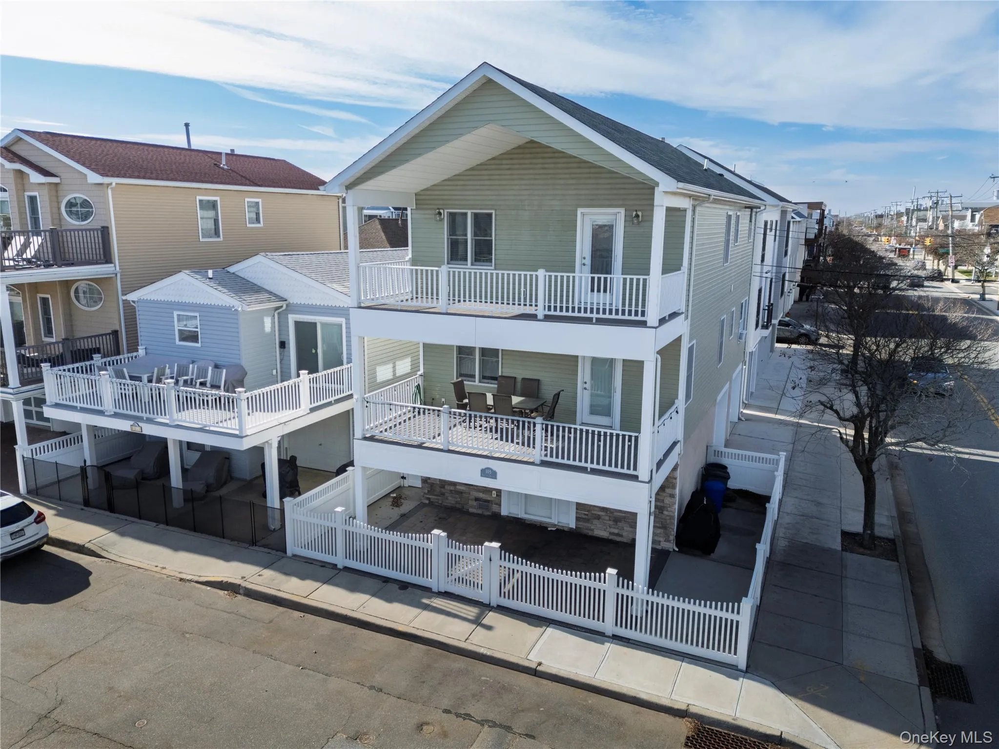Rear view of house featuring a fenced front yard and a residential view Rear view of house featuring a fenced front yard and a residential view