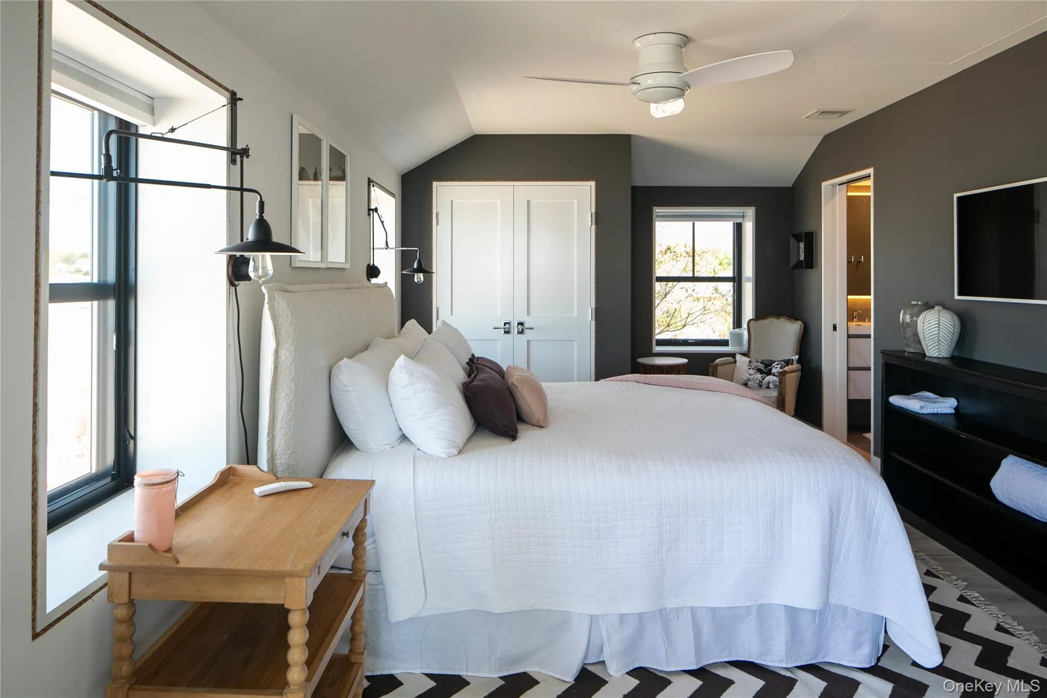 Bedroom featuring vaulted ceiling, a closet, and ceiling fan Bedroom featuring vaulted ceiling, a closet, and ceiling fan