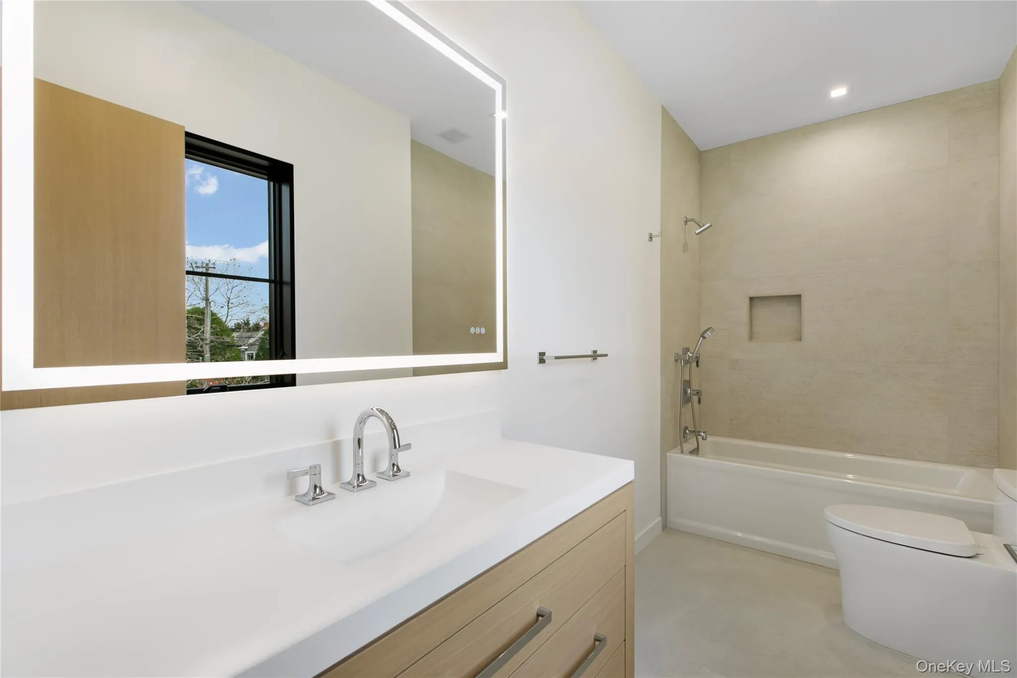 Bathroom with vanity and washtub / shower combination Bathroom with vanity and washtub / shower combination