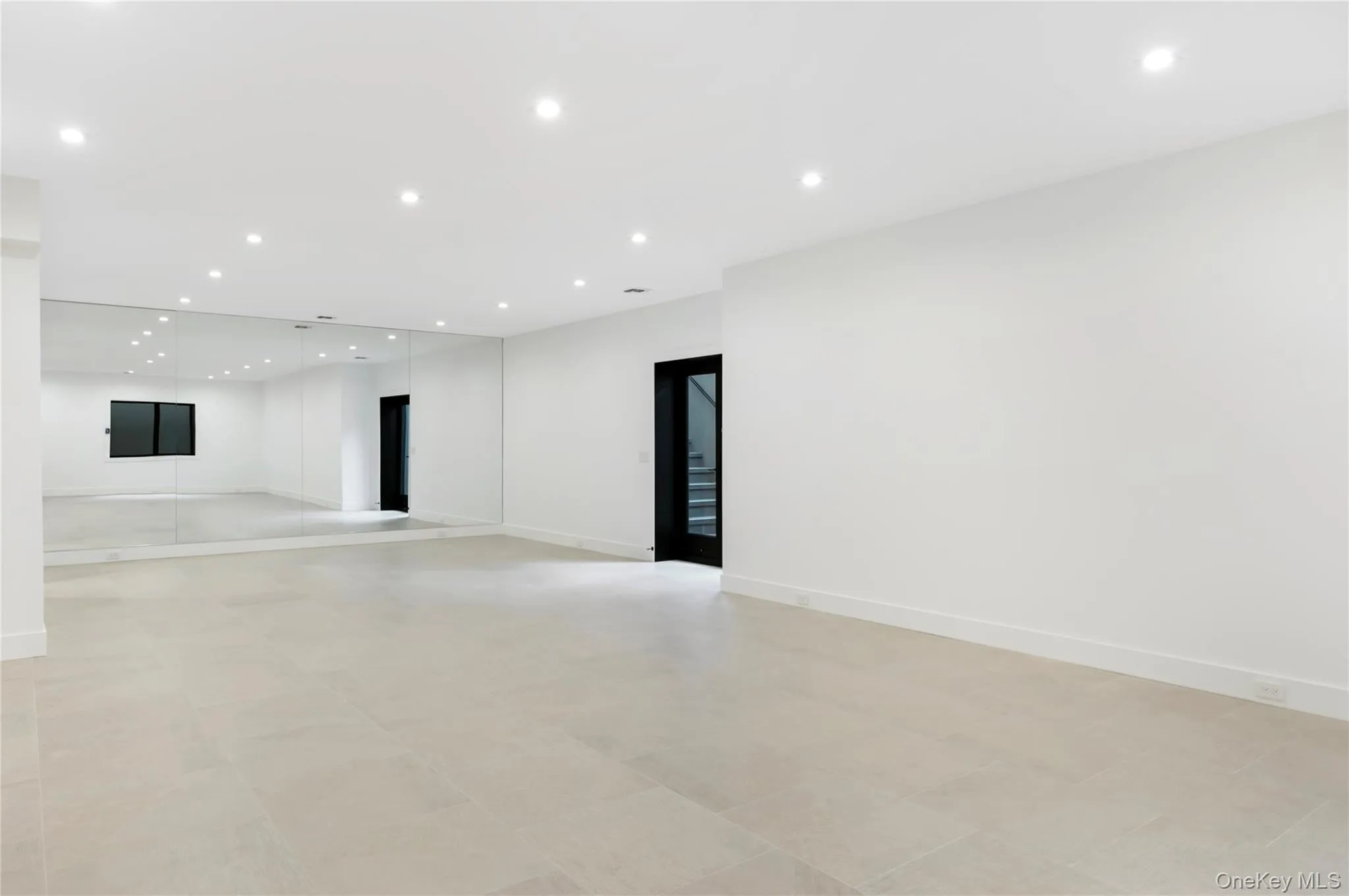 Unfurnished room featuring recessed lighting and baseboards Unfurnished room featuring recessed lighting and baseboards
